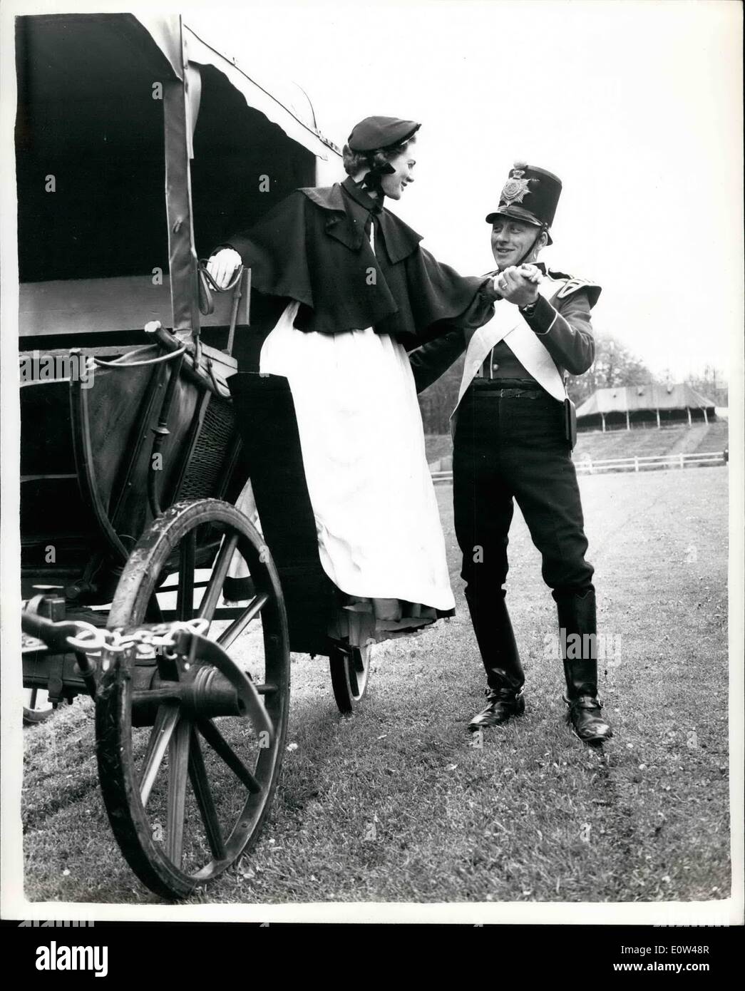 Jun. 06, 1961 - Preview Of The Aldershot Tattoo ''Florence Nightingale'': A daylight preview of the Aldershot Tattoo was held on the Rushmoor Arena, Aldershot this afternoon. Photo shows. Driver R. Turnell (RASC) in period costume of the Crimes-assists ''Florence Nightangale''-(Major Joan Moriarty from the Cambridge Military Hospital) from the original Nightingale coach-this afternoon. Stock Photo