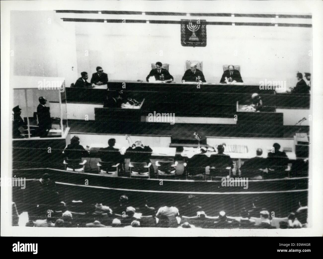 Apr. 04, 1961 - Opening of the Adolf Eichmann trail - in Jerusalem. The trial opened this morning in Jerusalem of Adolf Eichmann - former Nazi s.s.colonel - on charges of the mass murder of millions of Jews - in concentration camps during the war. photo shows General view of the scene in the courtroom - at opening of the trial this morning. Adolf Eichmann can be seen in his special bullet proof dock - on left center back is president of the court Moshe landau, with the other tribunal members - judge Halevi (left) and Judge raveh (right) Stock Photo