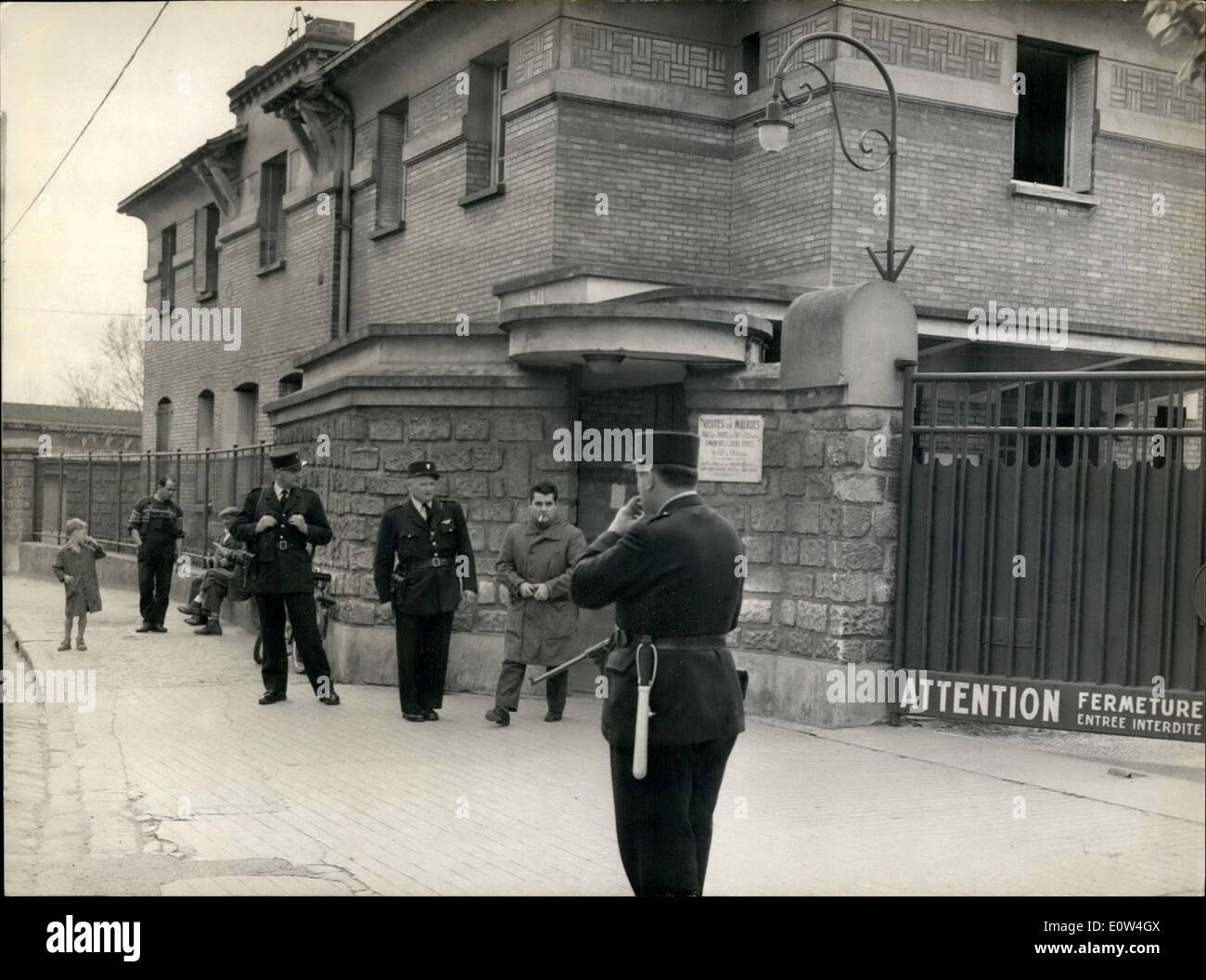 Apr. 04, 1961 - Arab Terrorists Slay 2 Wound 12 in Paris Area Hospital Raid. Algerian Nationalist Gunmen posing as visitors terrorised a suburban Paris Hospital with submachine guns yesterday leaving two dead and twelve injured. They sprayed two Montfermeil Hospital Wards and Courtyard with bullets in a attempt to murder a member of a rival Algerian Nationalist Movement. OPS: Policemen carrying submachine guns guarding the entrance to the Hospital this morning. Stock Photo