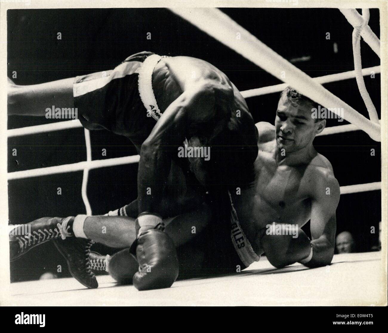 Apr. 18, 1961 - World Light-Weight Title Fight Between Dave Charnley And Joe Brown At Earls Court Photo Shows: Charnley and Brown both slip to the canvas in the first round of their contest at Earl's Court this evening. Stock Photo