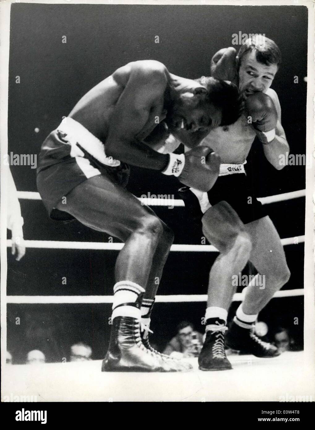 Apr. 18, 1961 - World light weight title fight between Dave Charnley (G.B) and Joe Brown (U.S) at earls court: Photo shows Brown ducks from a two - fisted attack from Charnley during their first round of the contest this evening. Stock Photo