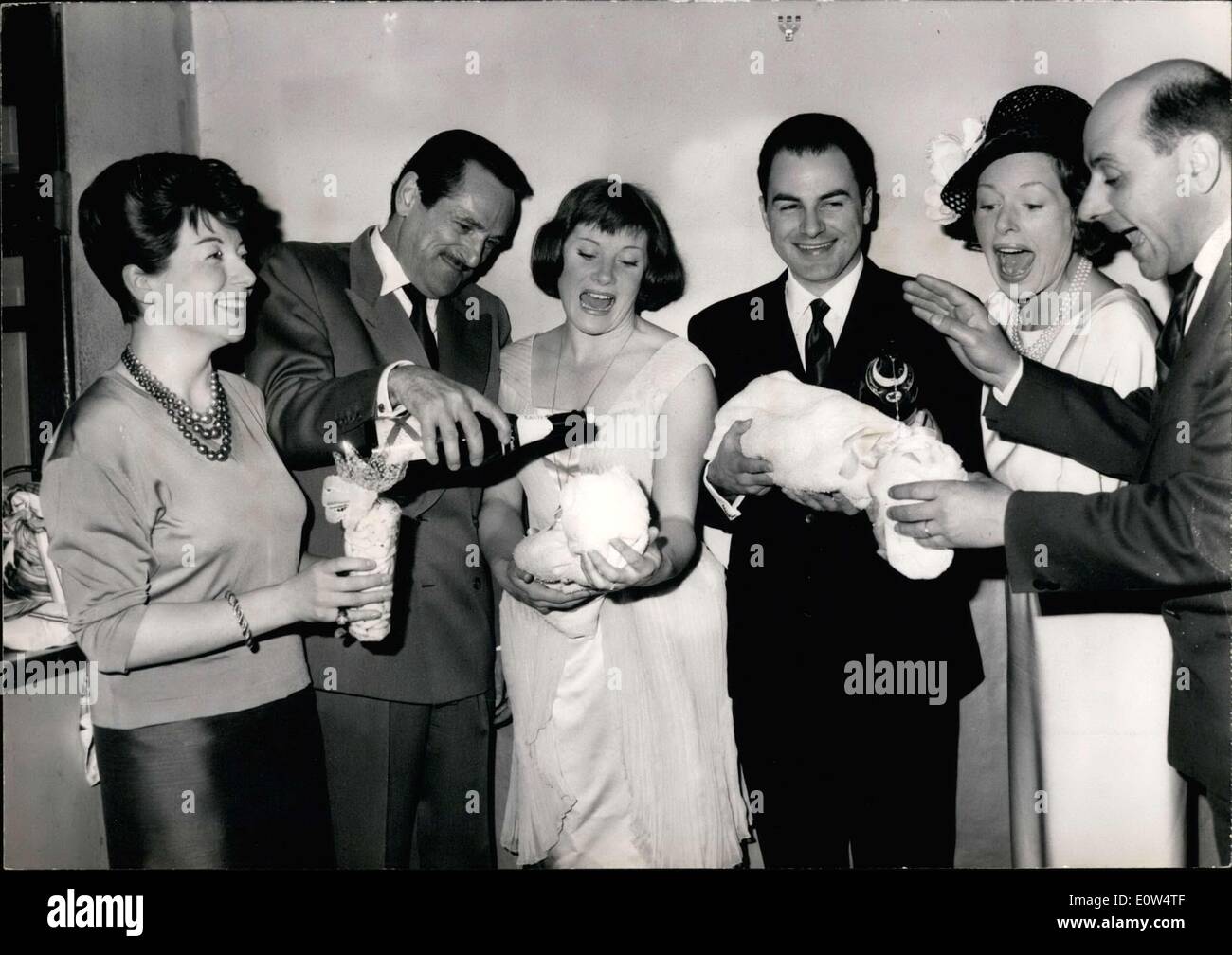 Apr. 19, 1961 - At Gramont Theater, in the presence of the stars of ''Irma la Douce,'' the musical comedy that is famous throughout the world, the twins of Irma and Nestor was baptized with champagne. Pictured from left to right: Marthe Mercadier, Jacques Dumesnil, Colette Renard, Michel Rony, Madeleine Robinson, & Rene Dupuy. Stock Photo