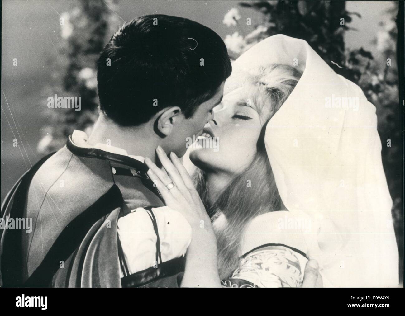 May 05, 1961 - Co-stars with Alain Delon in ''Famous Lovers'': Brigitte Bardot Stars in one of the sketches of the film ''Famous Lovers'' reviving some famous Romances throughout Centuries. B.B. Impersonates a young Bavarian Girl with whom Prince Albert of Bavaria (Alain Delon) falls in love. The ivers come to a tragic end. Photo shows Brigitte Bardot and Alain Delon in a scene of the film. Stock Photo