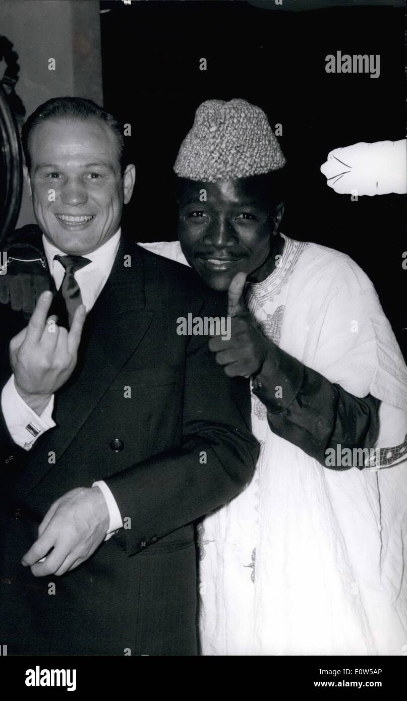 Sep. 09, 1961 - Boxer Meets At Maxim's: Phot Shows Gracieux Lamperti, Europe's feather weight champion left Fraternising with his future opponent. The Nigerian Joe ''Rafiu'' King during a reception at Maxim's to-day. The fight will be held at the Palais Des Sports, Paris. Stock Photo