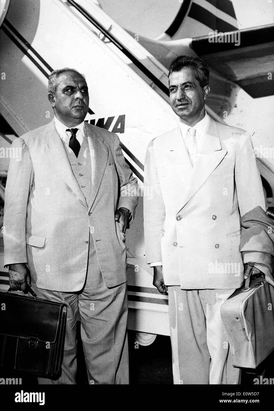 Jul 04, 1961; Geneve, Switzerland; The members of the politique bureau of Neo Destour met yesterday in Geneve, approved to participation in the government of Ben Amar. The picture shows Mr. MAHOMET BADRAS (L) at his arrival at the Geneve airport and ALI BALHAWAN (R) member of the Neo Destour. Stock Photo