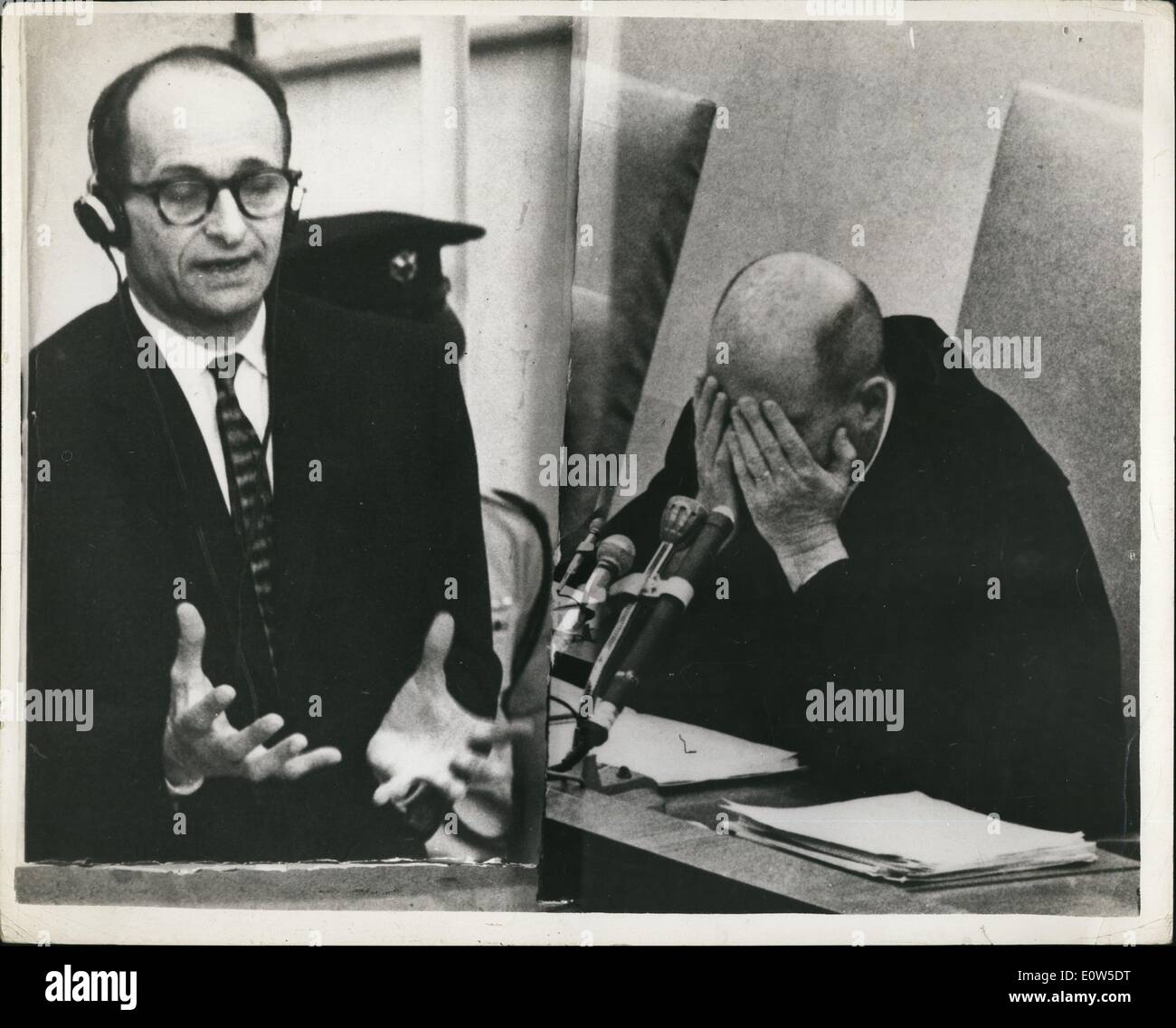 Jul. 07, 1961 - Eichmann Trial Drags On And On The trial of Adolf Eichmann, charged with the alleged murder of ''six million Jews'', is continuing in Jerusalem. Photo shows Adolf Eichmann in his bullet-proof glass dock at the Jerusalem Court explains, a point in his evidence; Presiding Judge Moishe Landau, expresses weariness as he rests a moment while the shorthand recorder clears up a point with the translator. Stock Photo
