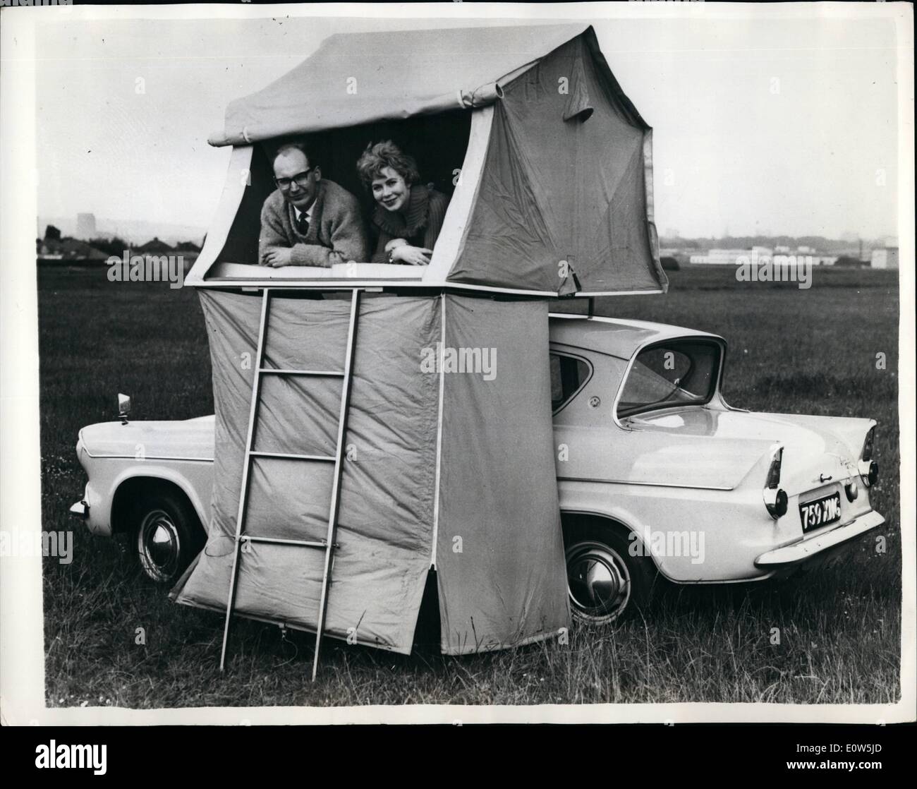Sep. 09, 1961 - The international caravan exhibition in London You pitch your tent on top of your car: High and dry camping, whatever the weather, and no insects to worry you - these are of the advantages offered by the new ''Trotent'' on show at the international caravan exhibition opened at Earls Court, London. Manufactured by the Lambretta/Trojan group of companies of Croydon, survey, the tent can be errected in one minute. It sleeps two, on foam mattresses, and there is also a ''ground-floor'' compartment for dressing or for use as a loggis Stock Photo