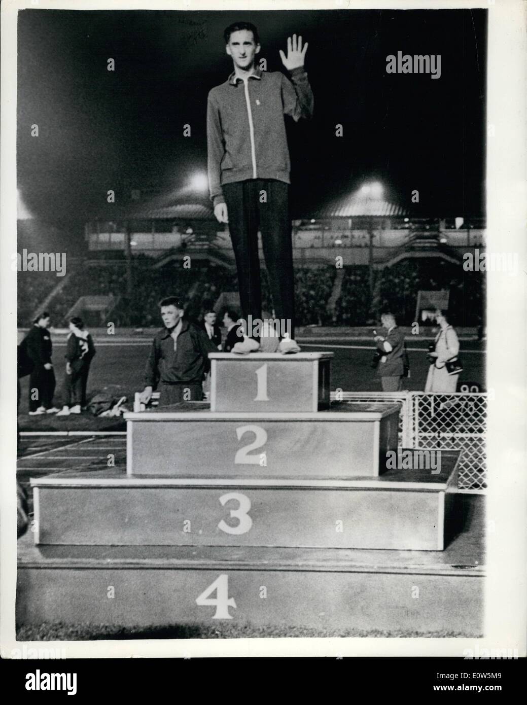 Sep. 09, 1961 - Gordon Pirie finished his career as an amateur runner by winning the 5,000 Metres at White City: Gordon Pirie, the stormy star of British athletics, said goodbye to the amateur running track last night with great triumph when he won the 5,000 metres in the England versus Russia match at the White City. He was given a huge reception by the 20,000 crowd after his great win. Photo shows from the place of honour Gordon Pirie Waves to the crowd. A crowd who have loved him through 12 turbulent years, having broken five world records and run for England in 30 countries Stock Photo