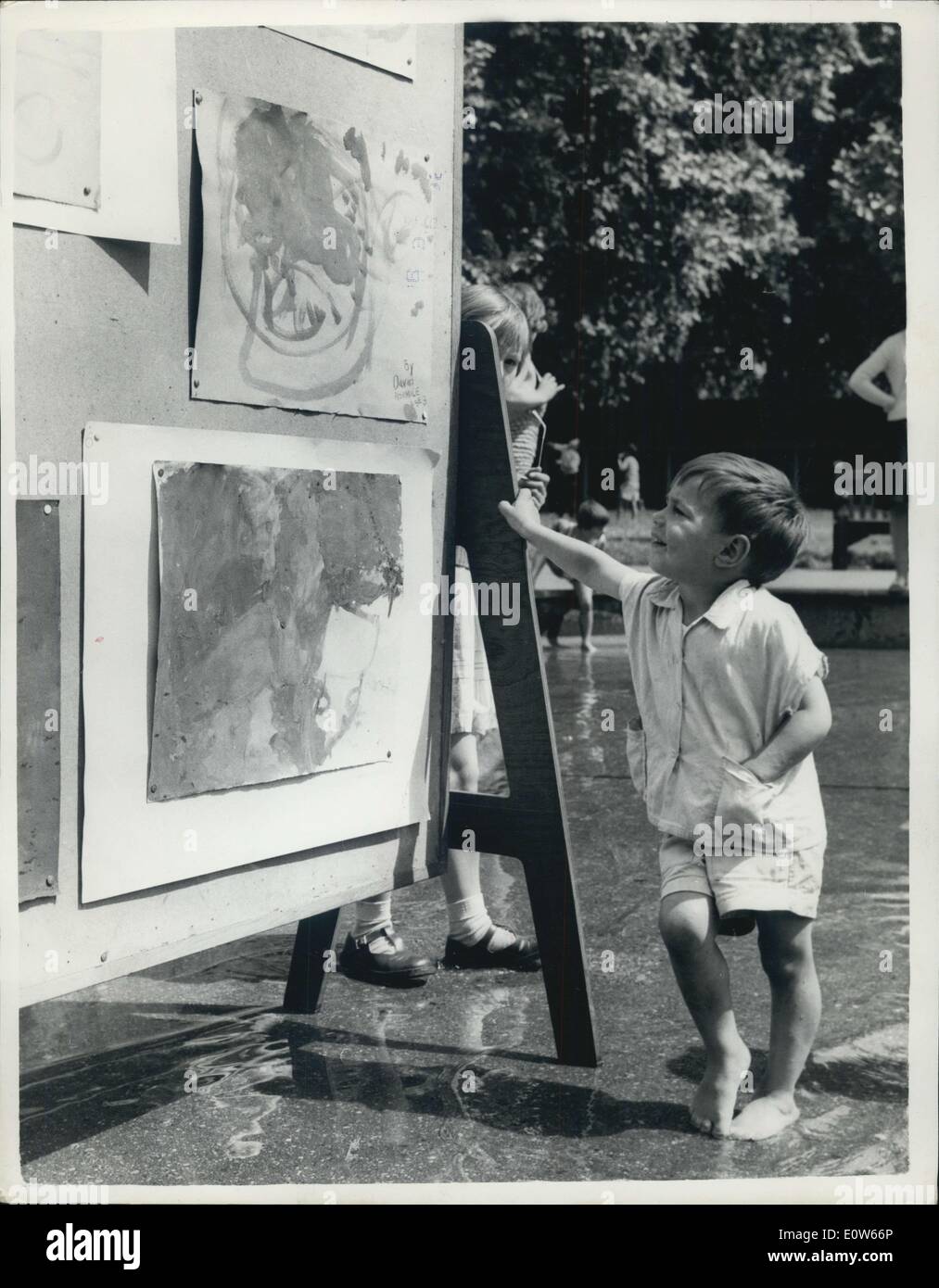 Jul. 31, 1961 - Young Artists And Critics Keep Cool At Exhibition: Two among the favourite recreation of youngsters are daubing Stock Photo