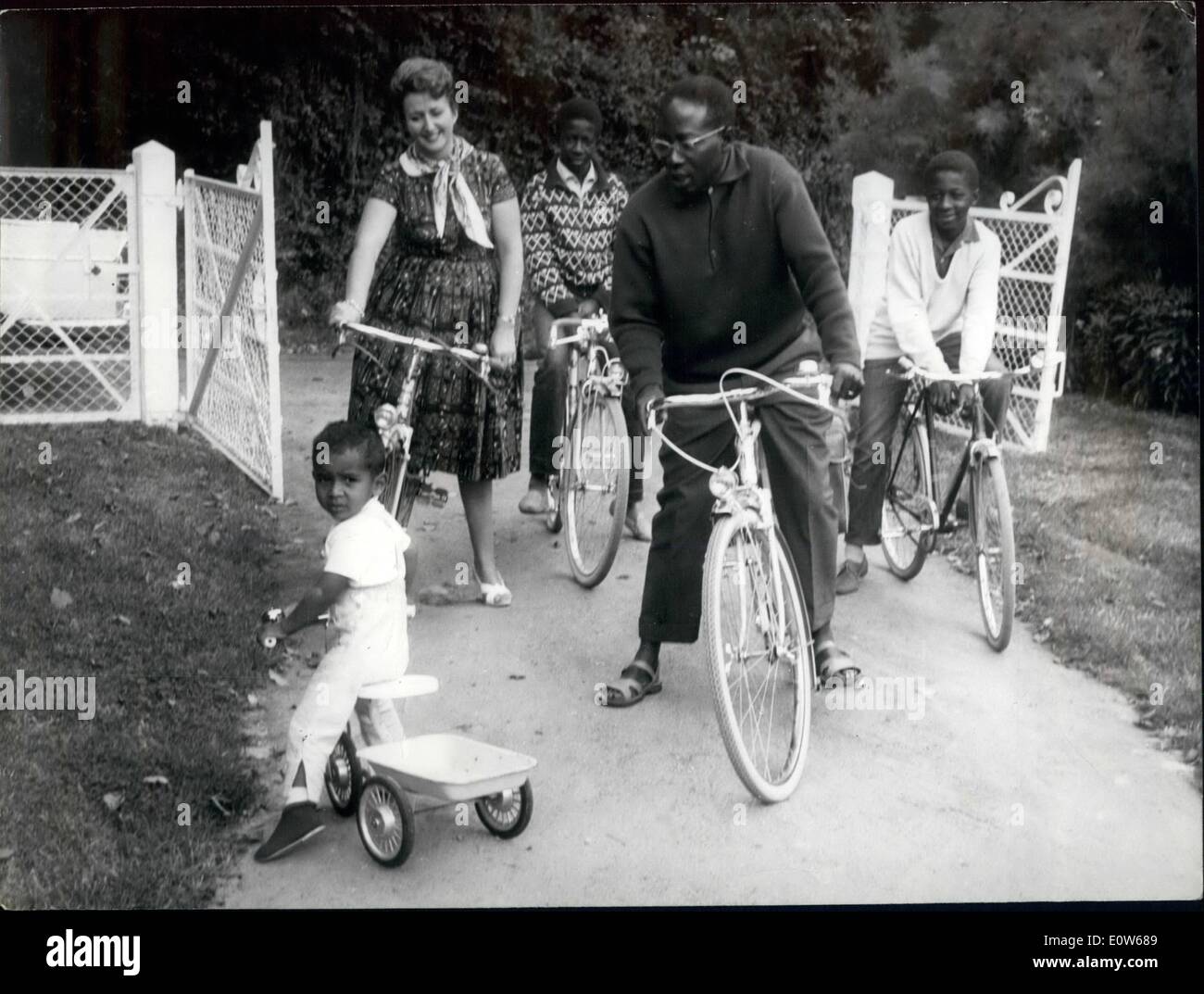 Aug. 08, 1961 - Senegal's President on Holiday in Normandy. M. Senghor, President of Senegal and his family (wife and three sons of a former marriage) are now holidaying at Cabourg, Normandy. OPS: President Senghor, his white wife and his three sons Phillipe, the youngest, Francis, 14 and Guy, 13 back from a bike outing. Stock Photo
