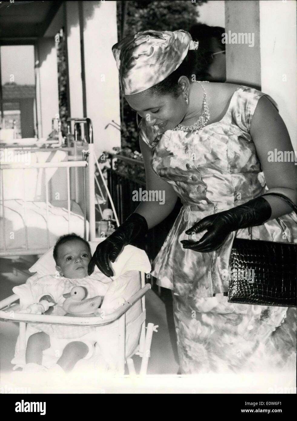 Sep. 27, 1961 - President of Nigeria ad his wife on state Visit to Paris: MME Diori Hamani wife of the Nigerian President pictured while visiting a Paris Nursery this afternoon. Stock Photo