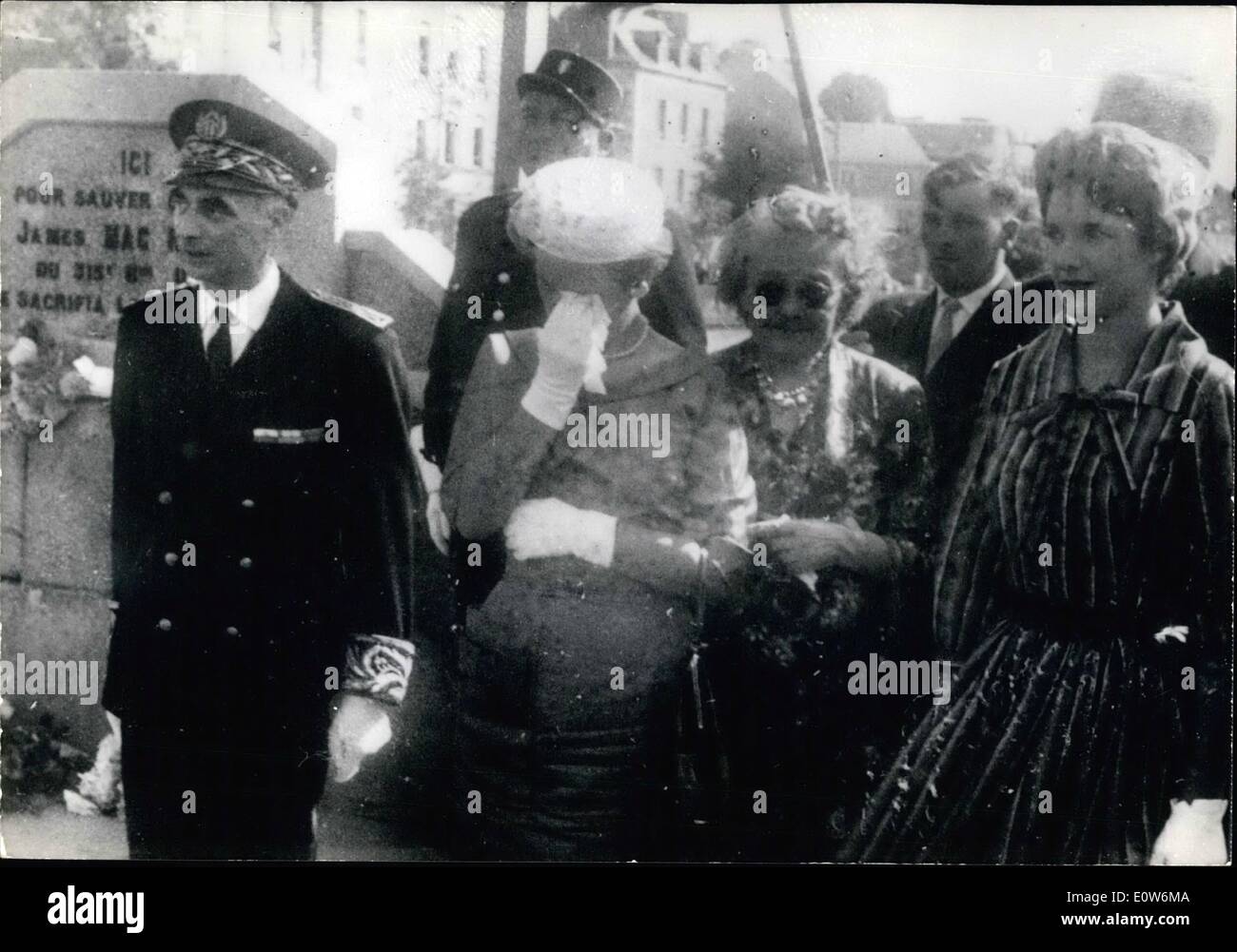 Aug. 08, 1961 - Macracken's Widow Weeps at Commemoration Ceremony: Mrs. Mae Macracken, Widow of the Heroic G.I. who was killed while trying to prevent the Germans from destroying the Mayenne Bridge in Brittany on August 5, 1944, Wept during the Commemoration Ceremony to which she was invited with her 18-year-old daughter Myrtis. Photo shows Mrs. Macraken weeps before the memorial tablet Commemoration the Heroic of her husband. On right, Myrtis. Stock Photo