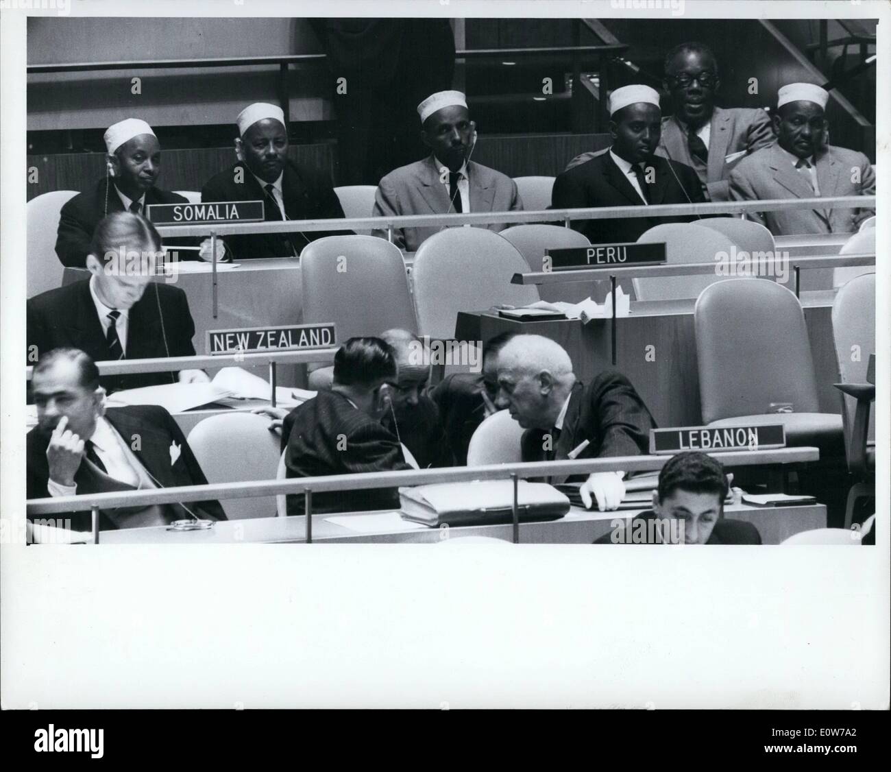 Oct. 10, 1961 - Four Somalian M.P.'s On Visit To United Nations: Four Somalian Parliamentarians, on a tour of the United States, visit on UN Headquarters today, They are seen here with the chairman of Somalia's UN delegation, Mr. Haji Farah Ali Omar (behind name plate, at left), listening to the Assembly's discussion on an investigation into the death of the late UN Secretary-General Dag Hammarskjold and his aides (The investigation was unanimously called for by a vote of 97 -C) The investigation MP's are (L-R) Mr Stock Photo
