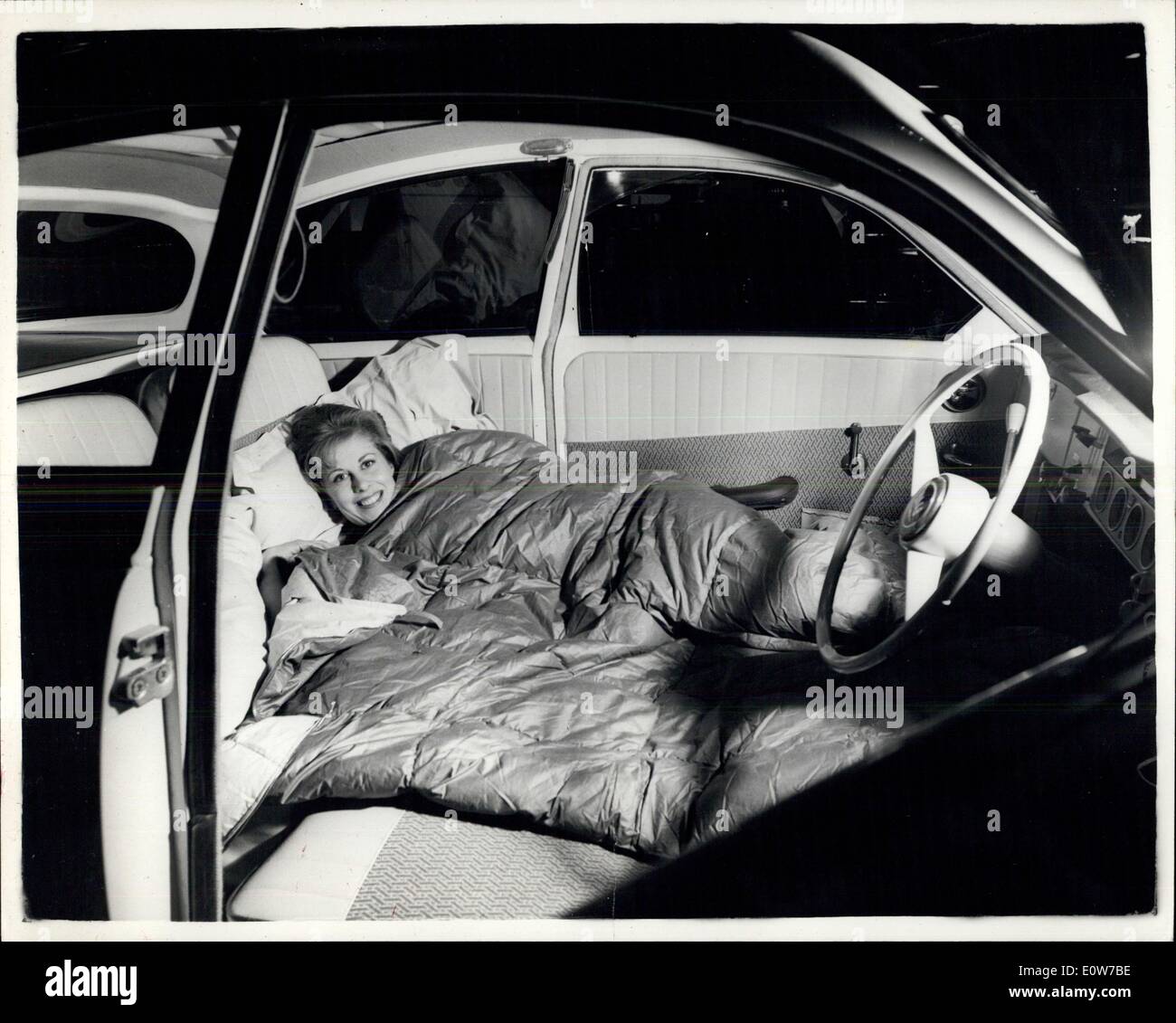 Oct. 17, 1961 - Motor Show Opens Tomorrow - The Motor Show Opens Tomorrow in London at Earl's Court - Photo Shows:- Catherine Burgess of Earl's Court with the New Swedish Saab. Its seas can be moved to make a bed inside the car. Stock Photo