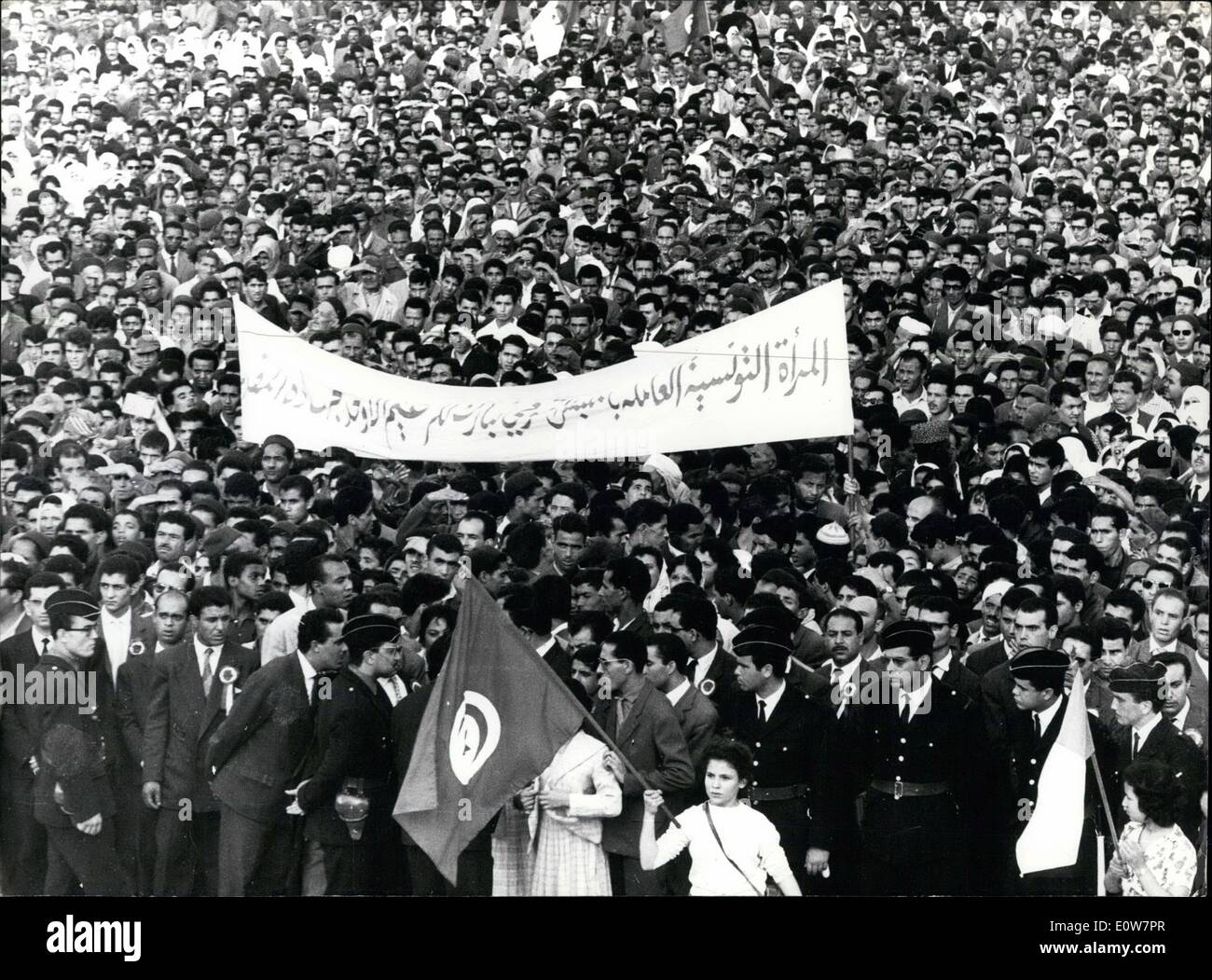 Nov. 11, 1961 - Tunisians Demonstrate Their Sympathy With Algerian Rebels. A mass demonstration was held in Tunis yesterday, the occasion was the seventh Anniversary of the Algerian Revolt. OPS: Huge Crowd of Tunisian demonstrators, a little girl (Foreground) is seen waving the Algerian Rebel Government Flag. Stock Photo