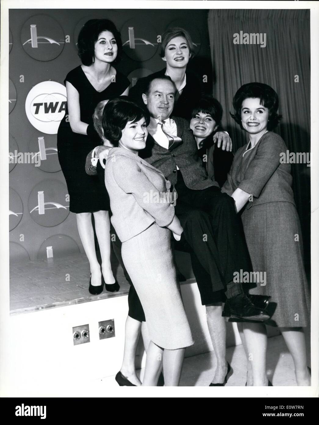 Nov. 11, 1961 - New York International Airport.... Bob Hope finds himself surrounded by N.Y. models on his arrival from London aboard a TWA Superjet. Bob just completed ''The Road to Hong Kong'' in London with Bing Crosby and on the flight across the Atlantic, saw a preview of his newest release, ''Bachelor in Paradise'', while jetting along at 30,000 feet. Quipped Bob, Here's one movie they couldn't walk out on. He will attend the film's New York premi&egrave;re. Stock Photo