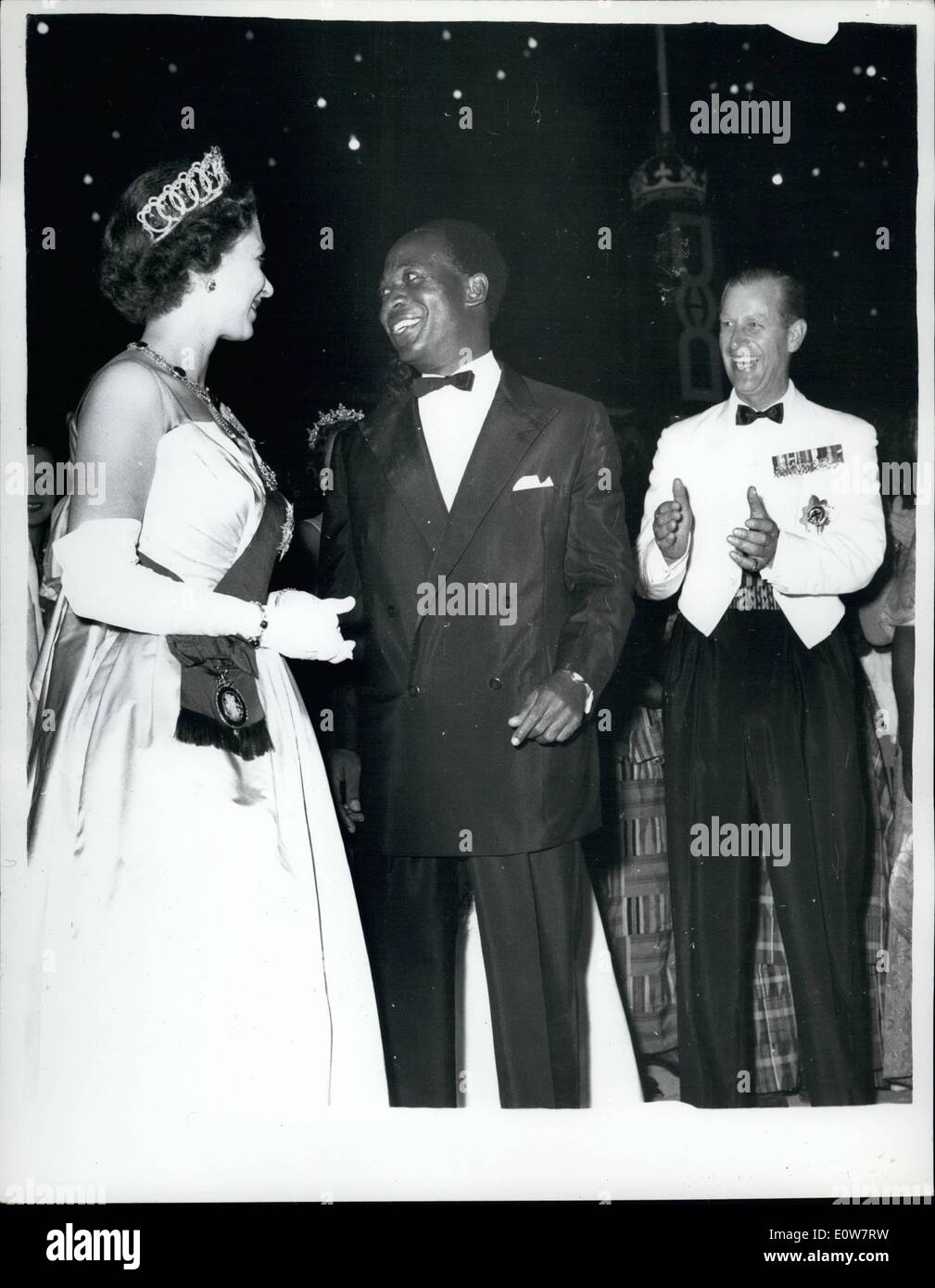 Nov. 11, 1961 - Queen Dances The ''High Life'' With Dr. Nkrumah. Night Out In Accra - Ghana: The Duke Of Edinburgh applauds - as H.M. The Queen and Dr. Nkrumah end their dance the ''High Life'' -during a ball at State House, Accra, Ghana - during the week-end. ''High Life is a Ghanian speciality - ma sort of cross between the Shimmy and the Charleston - in which the feet go one way - and the hips another. Stock Photo