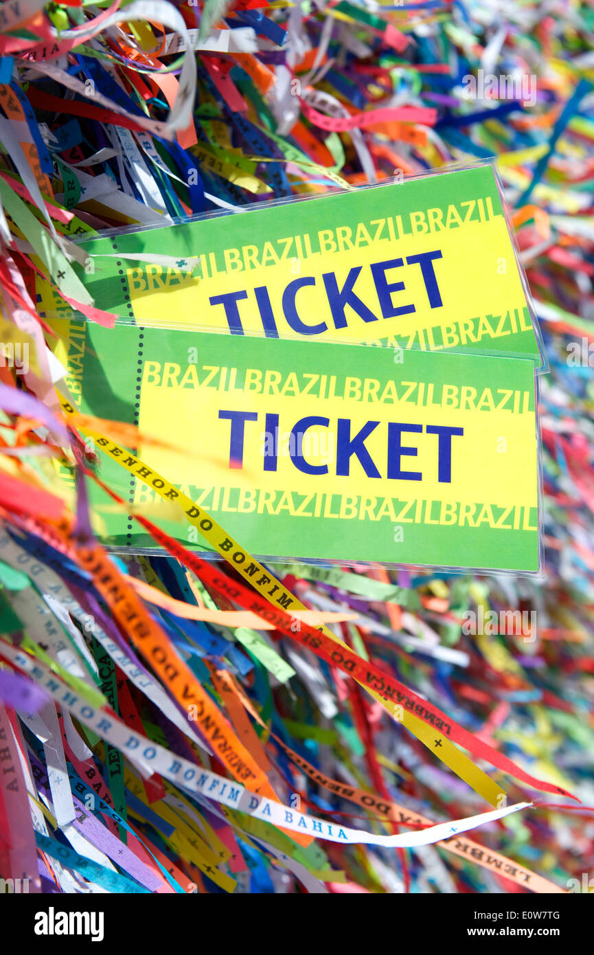 Pair of Brazil tickets in front of background of colorful Brazilian
