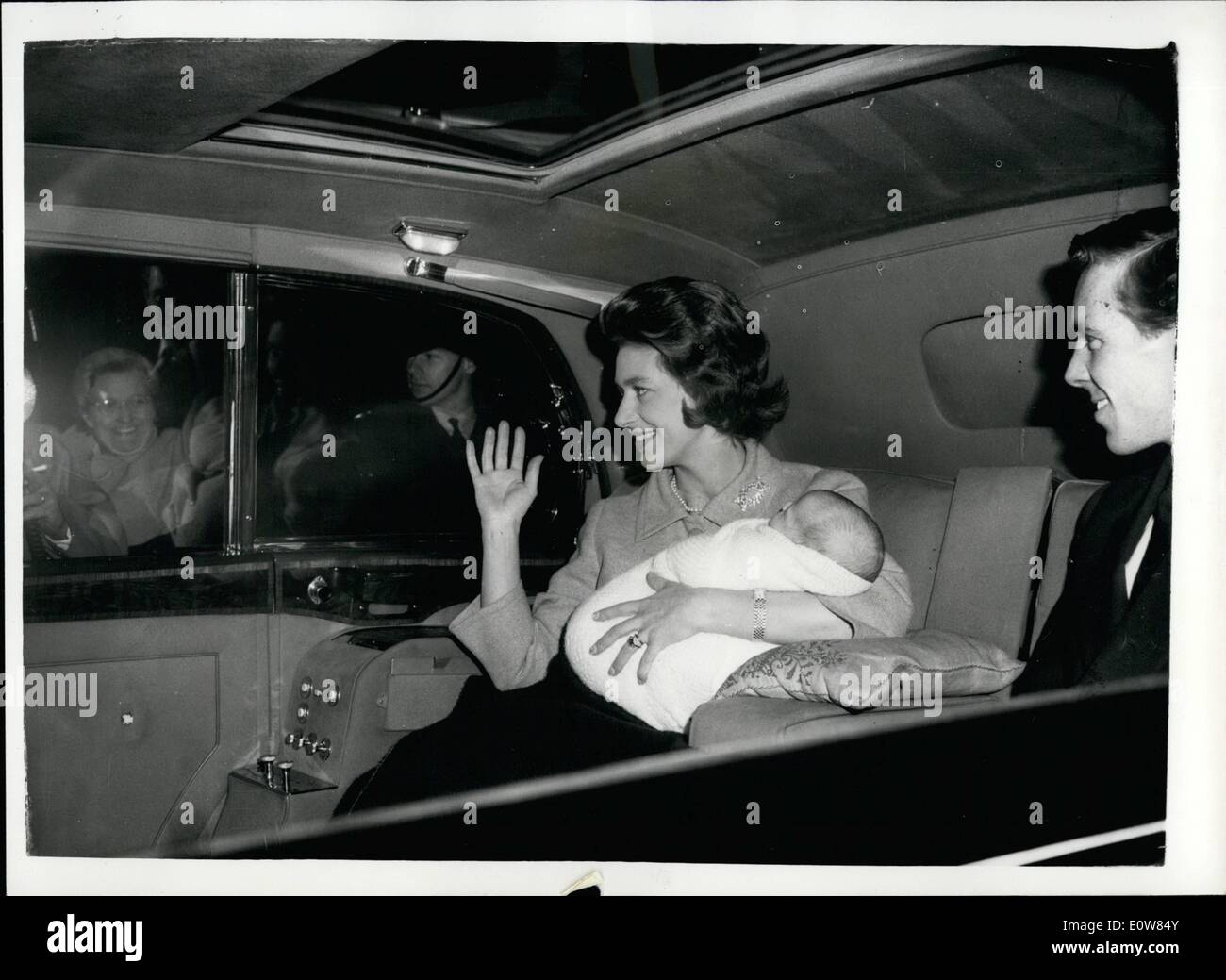 Nov. 11, 1961 - Princess Margaret and baby go home to Kensington Palace this afternoon: Princess Margaret and her 27-day-old son, Viscount Linley, returned home to Kensington Palace this afternoon. She had moved into Clarence House the night before the Royal baby was born. Photo shows Princess Margaret, holding Viscount Linely, with the Earl of Snowdon leaving Clarence House by car this afternoon. Stock Photo