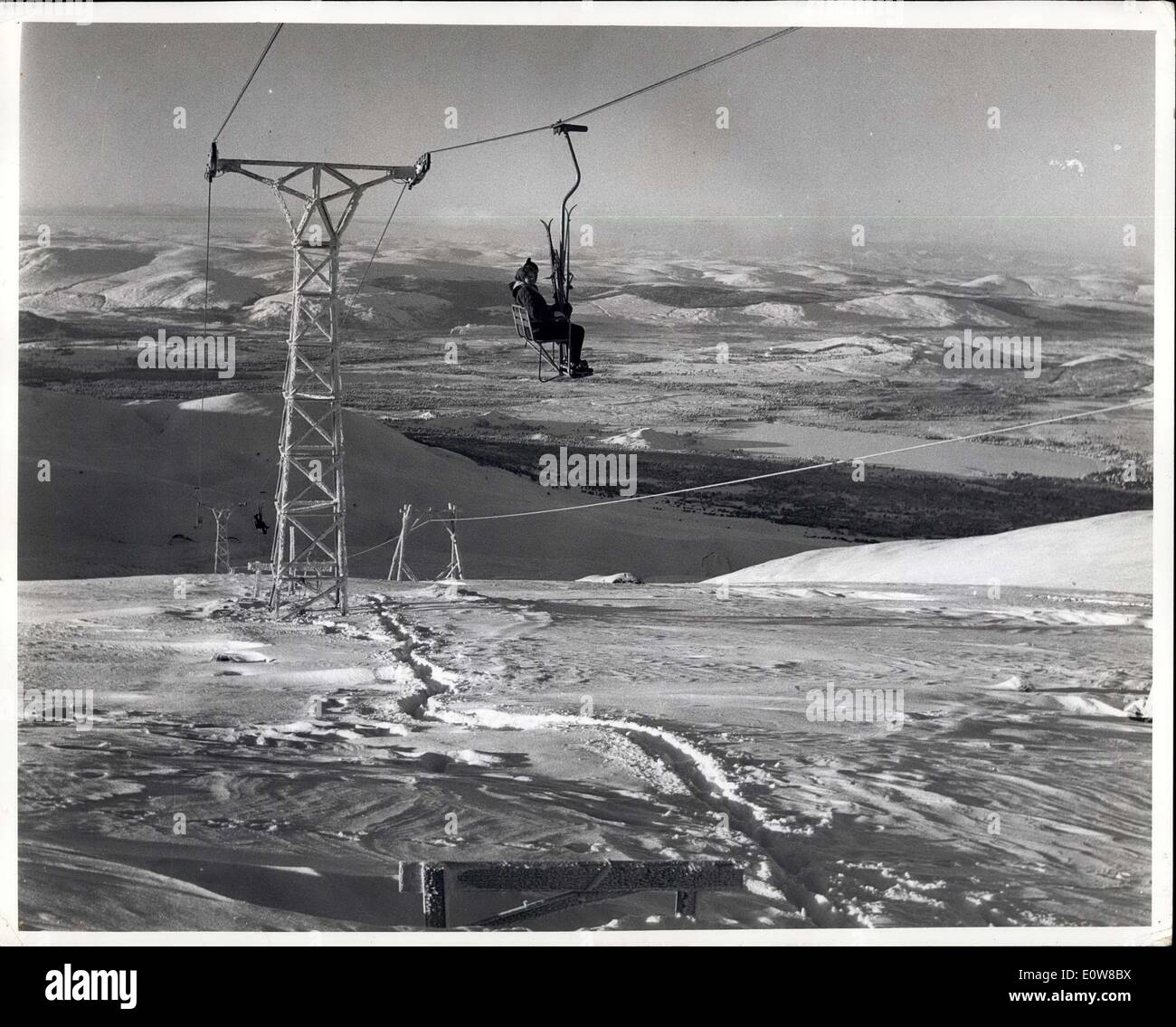Jan. 04, 1962 - Daily Herald, London. Winter Sports In Scotland. Scotland's biggest ski lift has just been opened in the Cairngorm Mountains 30 miles south of Inverness. Winter sports have now become big business i n Soctland instead of a prank as in kprevious years. The Speyside hteliers have combined to start the Cairgorn Development Association and put 120,000 into improving sports facilities. Already crowds of English and cottish visitors are enjoying skiing with similar facilities to those in Switzerland and Austria Stock Photo