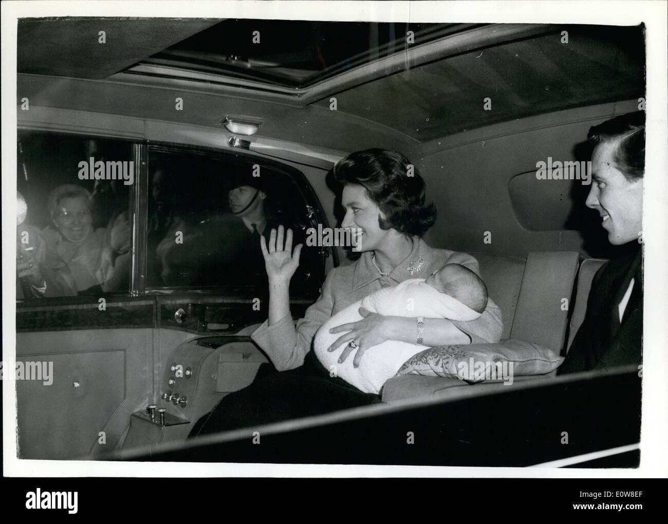 Nov. 11, 1961 - Princess Margaret and Baby Go Home to Kensington Palace this afternoon: Princess Margaret and her 27-day-old son viscount Linley, returned home to Kensington Palace this afternoon. She had moved into Clarence House the night before the Royal baby was born. Photo shows Princess Margaret, holding Viscount Linley, with the earl of Snowdon leaving Clarence House by car this afternoon. Stock Photo