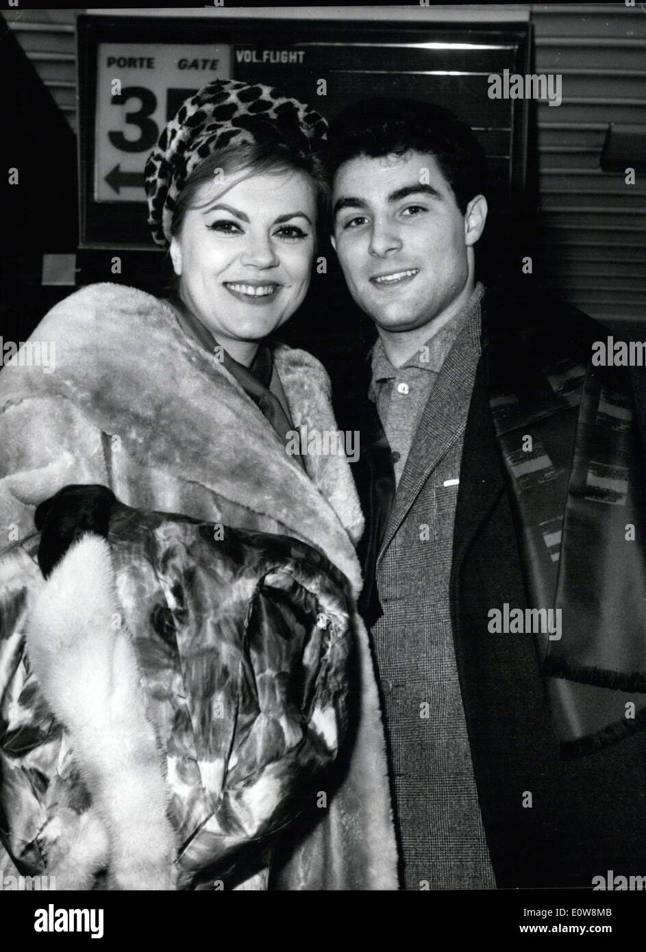 Jan. 23, 1962 - Jane Rhodes, the famous ''Carmen'' actress, left this afternoon for the US where she will give several presentations of the play ''Salome'' by Richard Strauss at the Metropolitan Opera. Her fiance, the famous orchestra conductor Roberto Benzi came to accompany her to the airport. Pictured: Rhodes and her fiance at Orly airport. Stock Photo