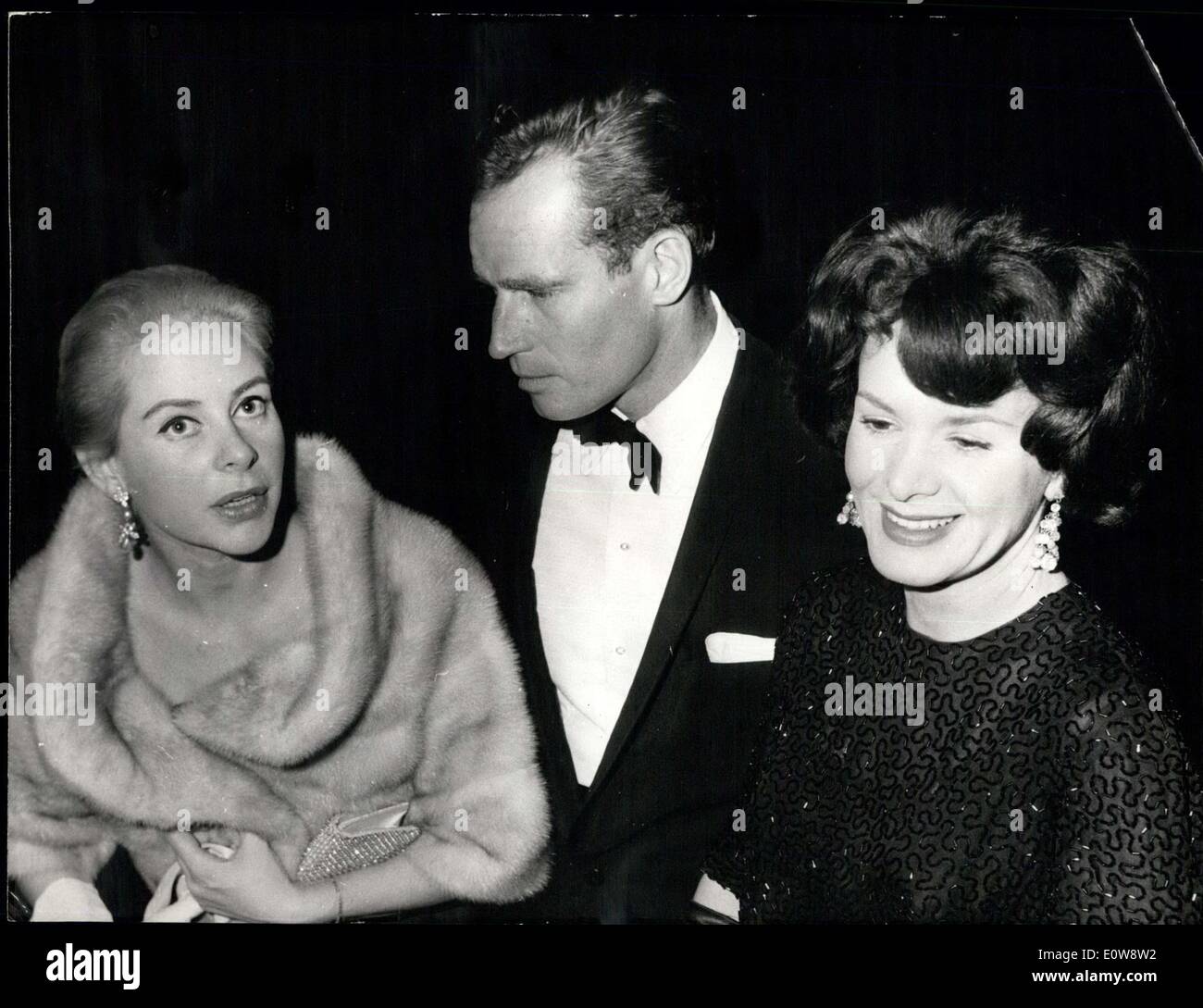 Dec. 09, 1961 - Charlton Heston at Paris premiere of ''EL CID'': charlton Heston and his wife attended the Paris premiere of ''EL CID'' last night. (Charlton Heston co-stars with Sophia Loren in the film). Charlton Heston pictured with his wife (right) and genevieve page (who impersonates a spanish princess in ''EL CIE' Stock Photo