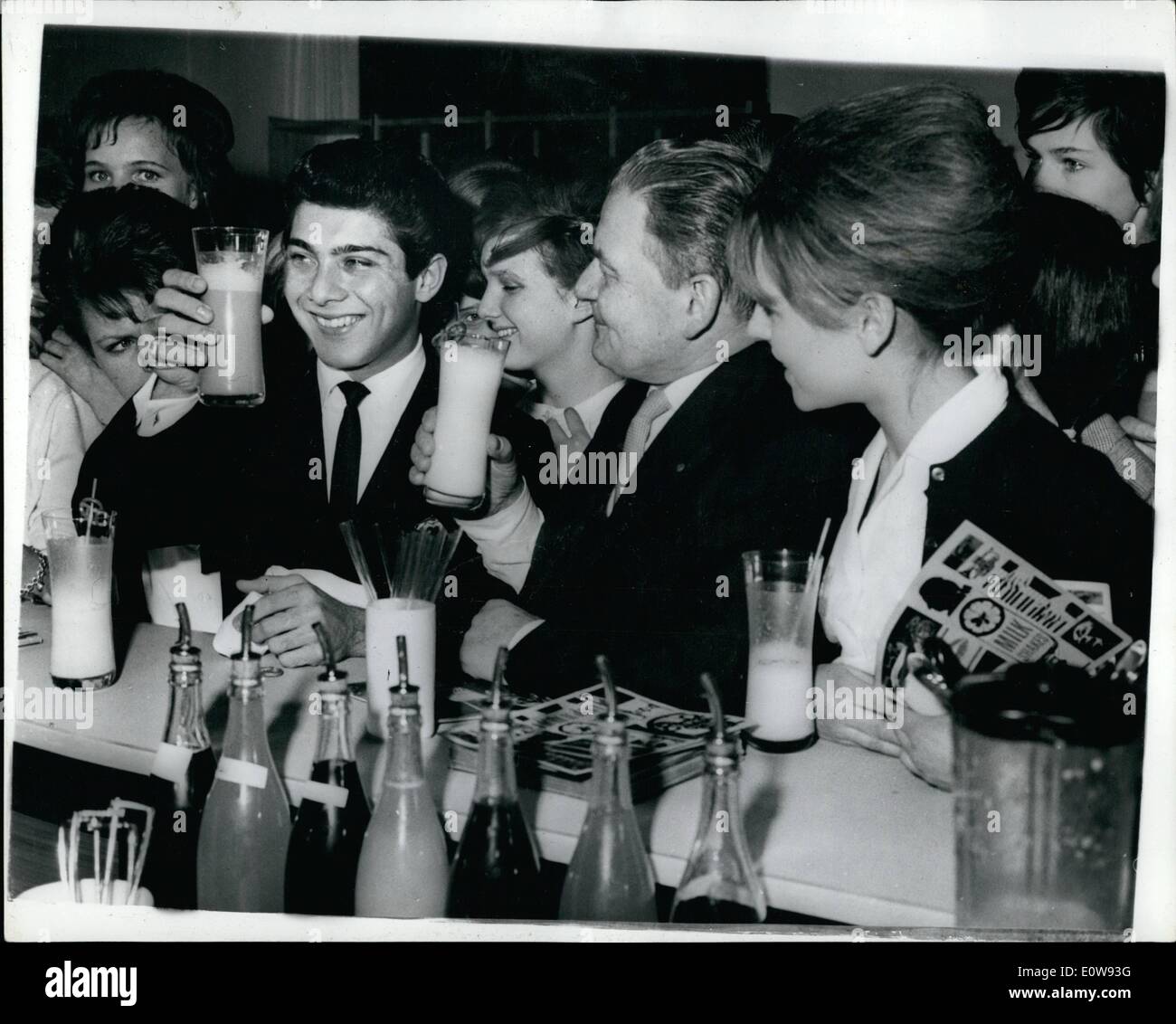 Feb. 02, 1962 - Paul Anka In The ''Milk-Pop-Bar'' In Copenhagen: Popular Singer Paul Anka met Danish teenagers - at a new establishment in Copenhagen --the ''Milk-Pop-Bar'' .. Established by the Danish Agrarian Council - the 'Bar' is designed to encourage youngsters to drink milk -- in any possible form -- such as milk-shakes, cream-soda's ..... It is also equipped with record players etc.. Photo Shows Paul Anka and the Danish teen-agers in the Copenhagen Milk Bar. Stock Photo