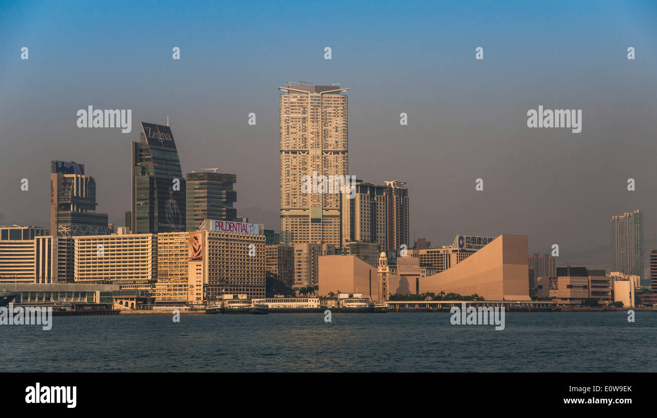 Skyline with pier, the Clock Tower and the Cultural Centre at the Tsim Sha Tsui Promenade, Kowloon, Hong Kong, China Stock Photo