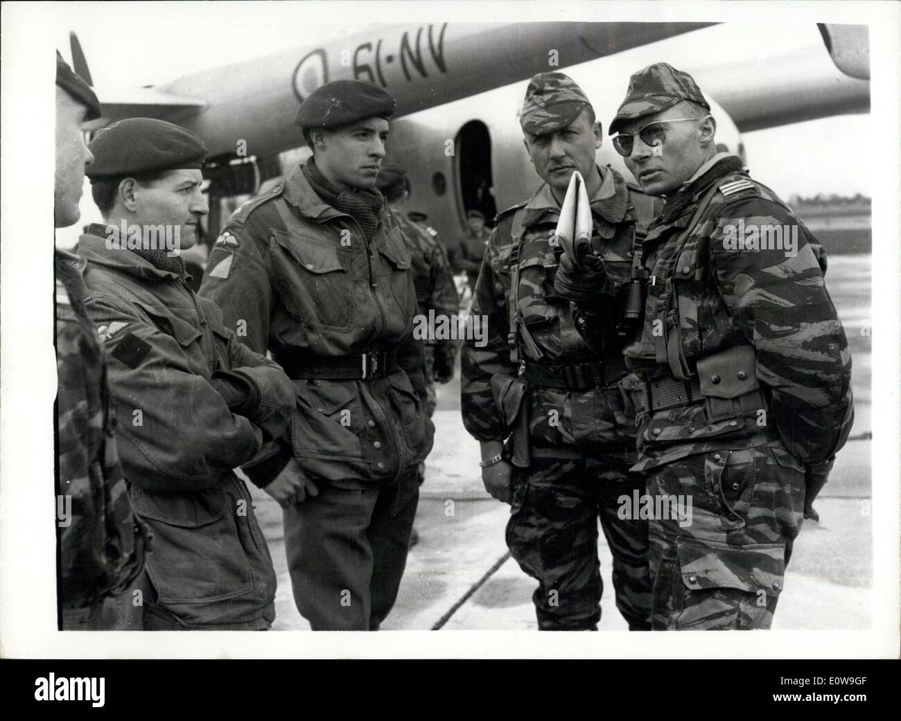 Apr. 03, 1962 - ''Les Para'' Arrive For Joint Exercise: Paratroops from the French Airborne Division arrived at Abbingdon, Berks, this morning to join the 1st Parachute Regiment for Exercise Broad Sweep, during which they'll jump over Dartmoor Photo Shows British Paratroops (at left) talks to two of their French counterparts on their arrival at Abbingdon today. Stock Photo