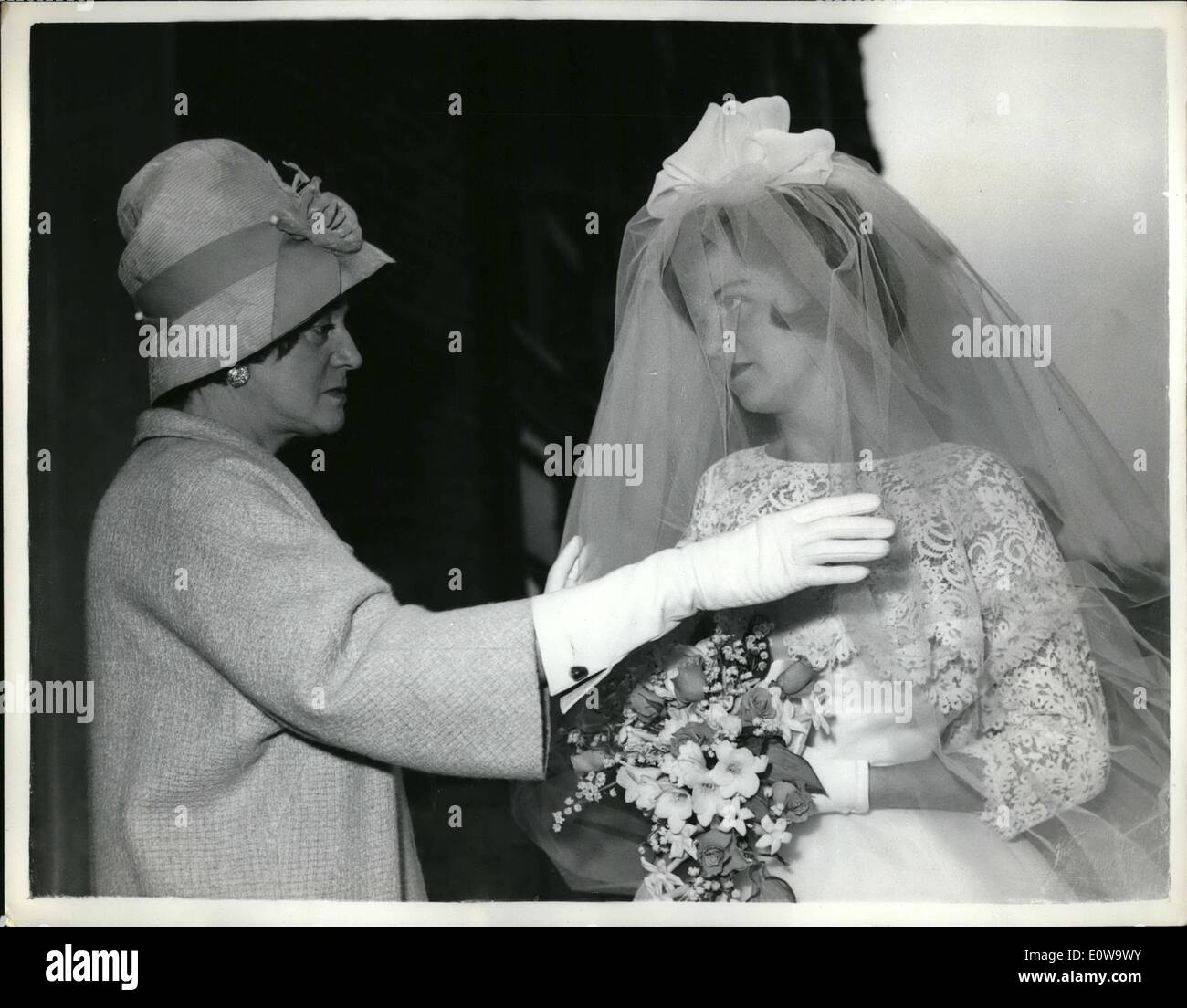 Apr. 04, 1962 - Odette's Marianne Marries Today: The marriage of Marianne Sanson, youngest daughter of George Cross heroine Mrs. Geoffrey M. Hallowes - Formerly Odette Sanson, the French Resistance heroine - to Michael Bates, of Guildford, took place this afternoon at the French Church, London. Photo Shows The bride's mother adjusts her daughter's headdress before the wedding today. Stock Photo