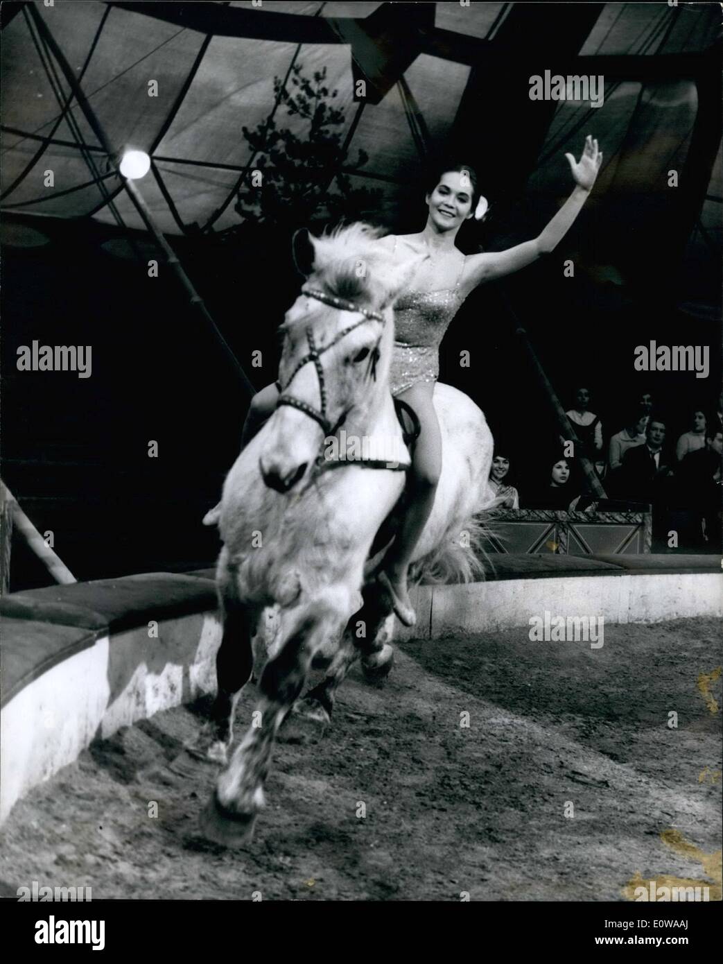 Mar. 10, 1962 - 10-3-62 Nancy Kwan does bareback riding act. Hong Kong Nancy Kwan, starring as an Italian in the film The Main Attraction being made at Sheeperton does a daring bareback riding act, both Nancy and the horse are bareback! Nancy, 22, who leaps on and off the horse's back as it trots around the ring, was caught by experts from the Bertram Mills Circus. Photo Shows: Riding high Nancy Kwan gives a confident smile during filming yesterday. Stock Photo