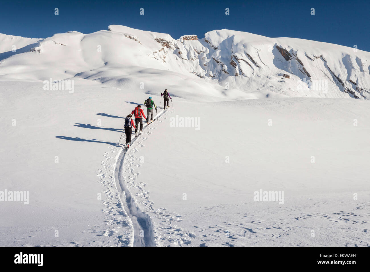 Ski tourers climbing Seekofel mountain, Fanes-Sennes-Prags Nature Park, Dolomite Alps, Seekofel mountain at the back, Kleiner Stock Photo