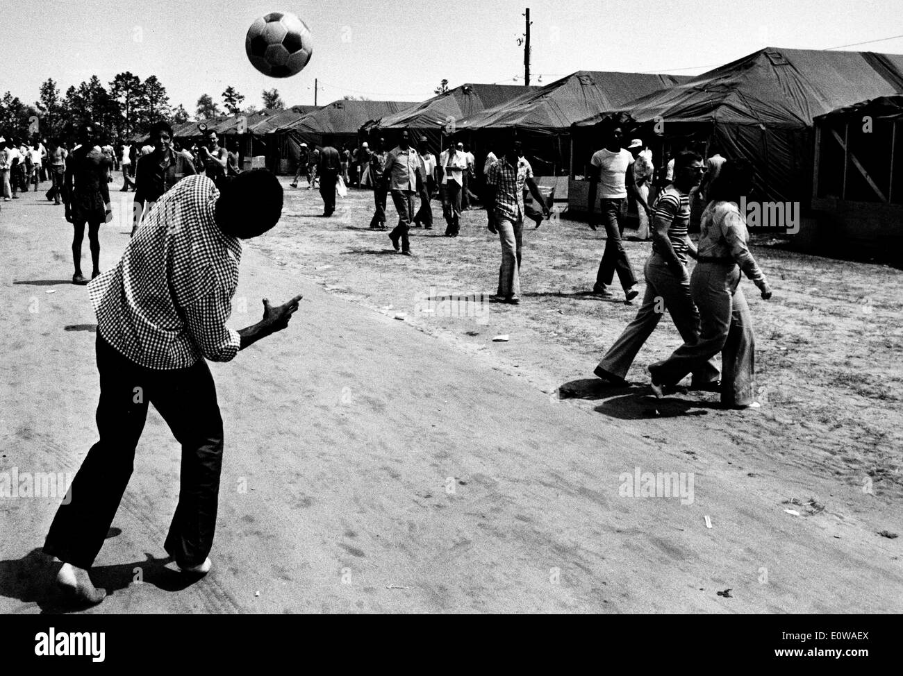 Cuban Refugees play soccer at tent city Stock Photo