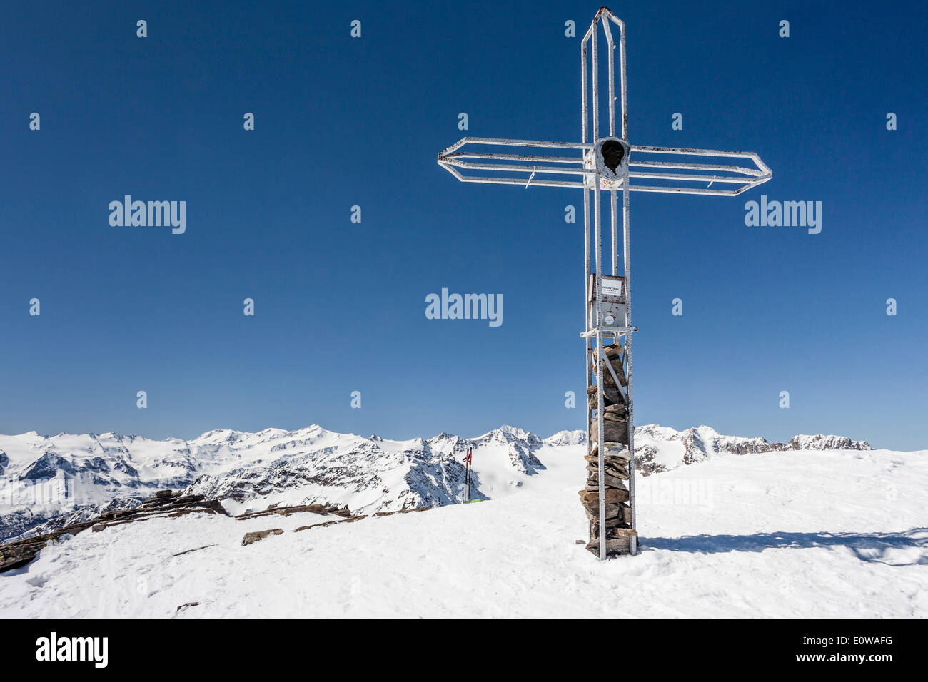 Summit cross on Laaser Spitze mountain, Martell Valley, Stelvio National Park, Ortler group including König mountain, Monte Stock Photo