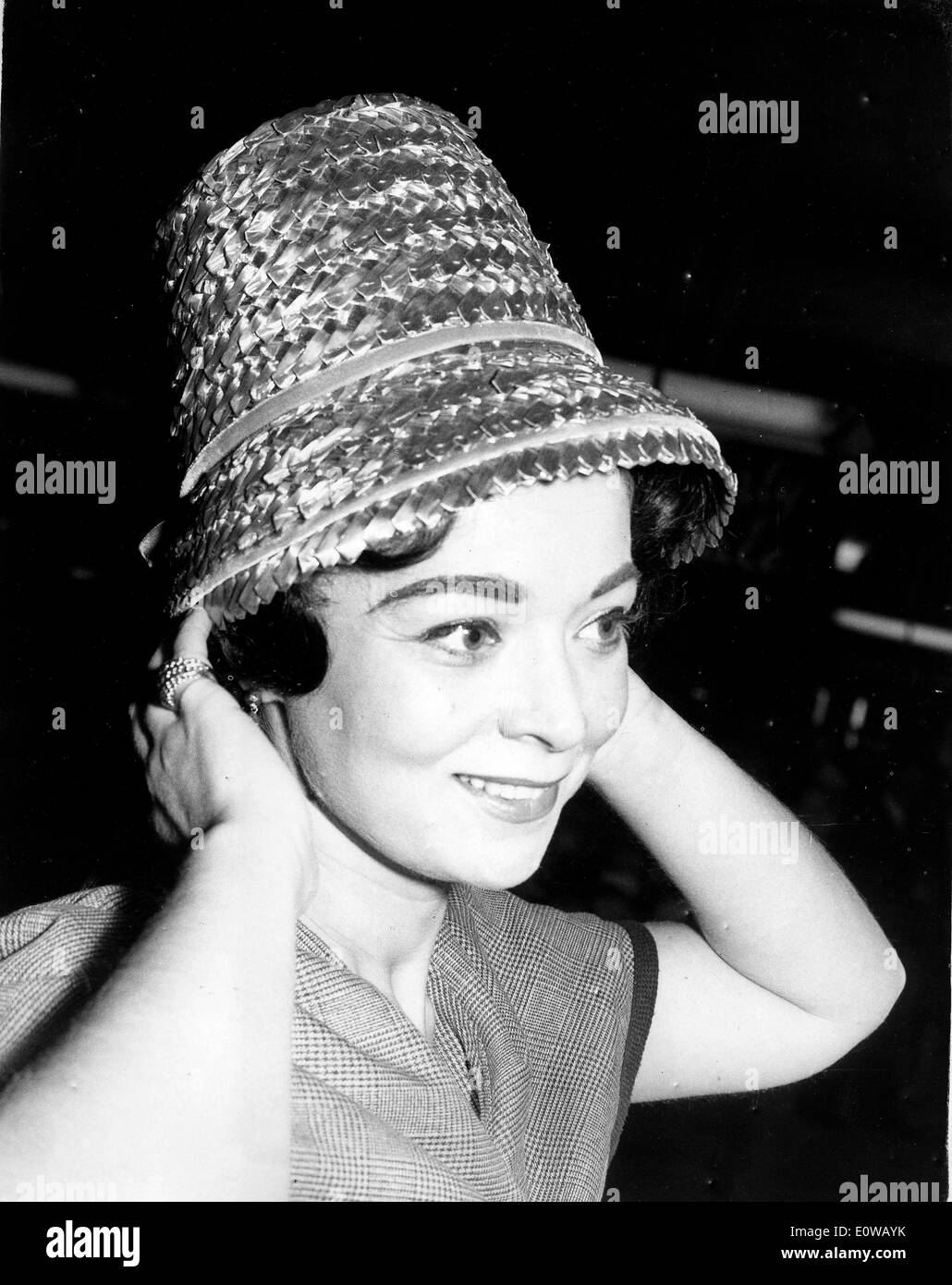 Woman modeling straw hat Stock Photo