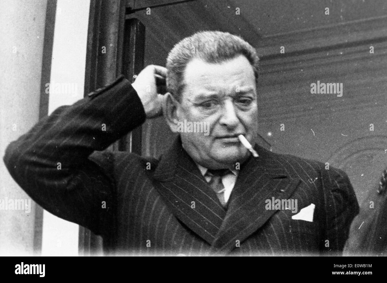 Prime Minister Joseph Laniel smokes a cigarette Stock Photo