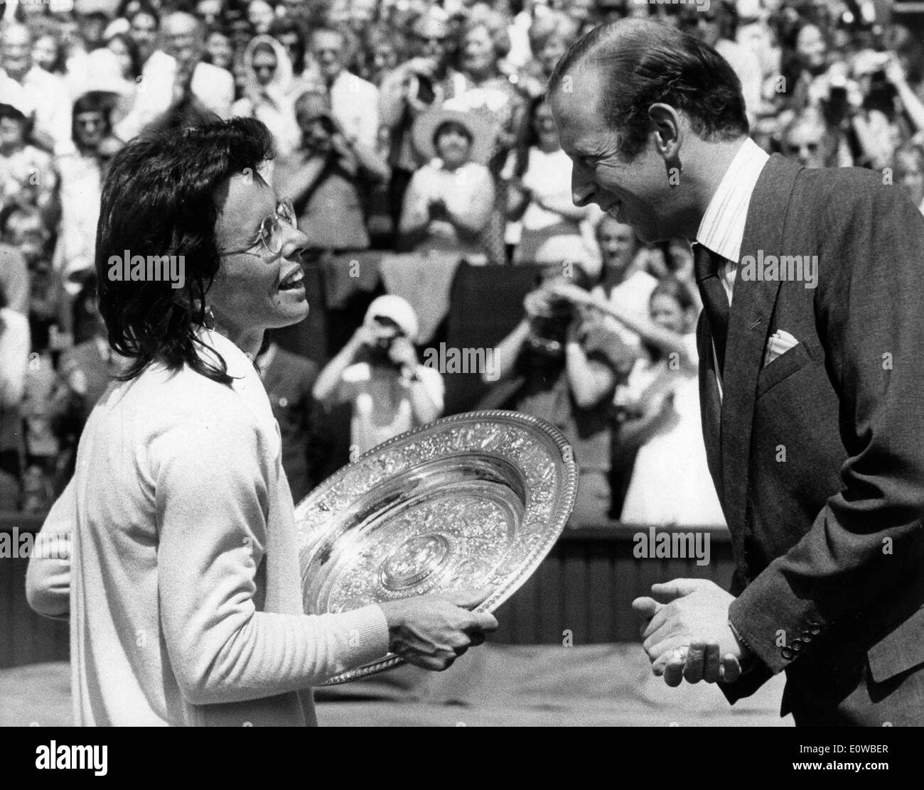Billie Jean King holds her trophy after winning a tennis match Stock