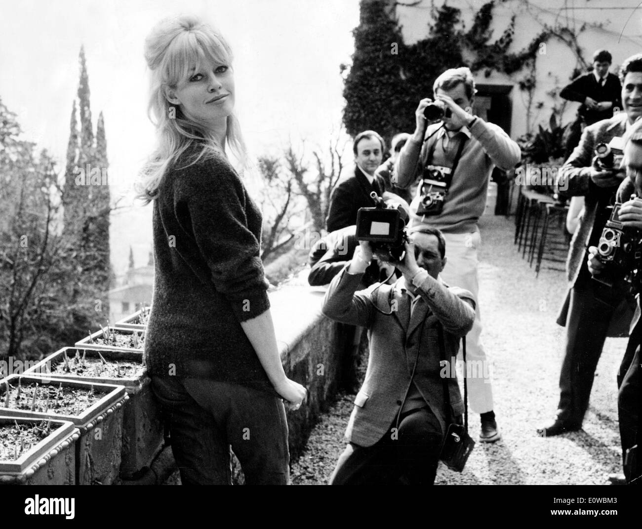 Actress Brigitte Bardot surrounded by paparazzi Stock Photo