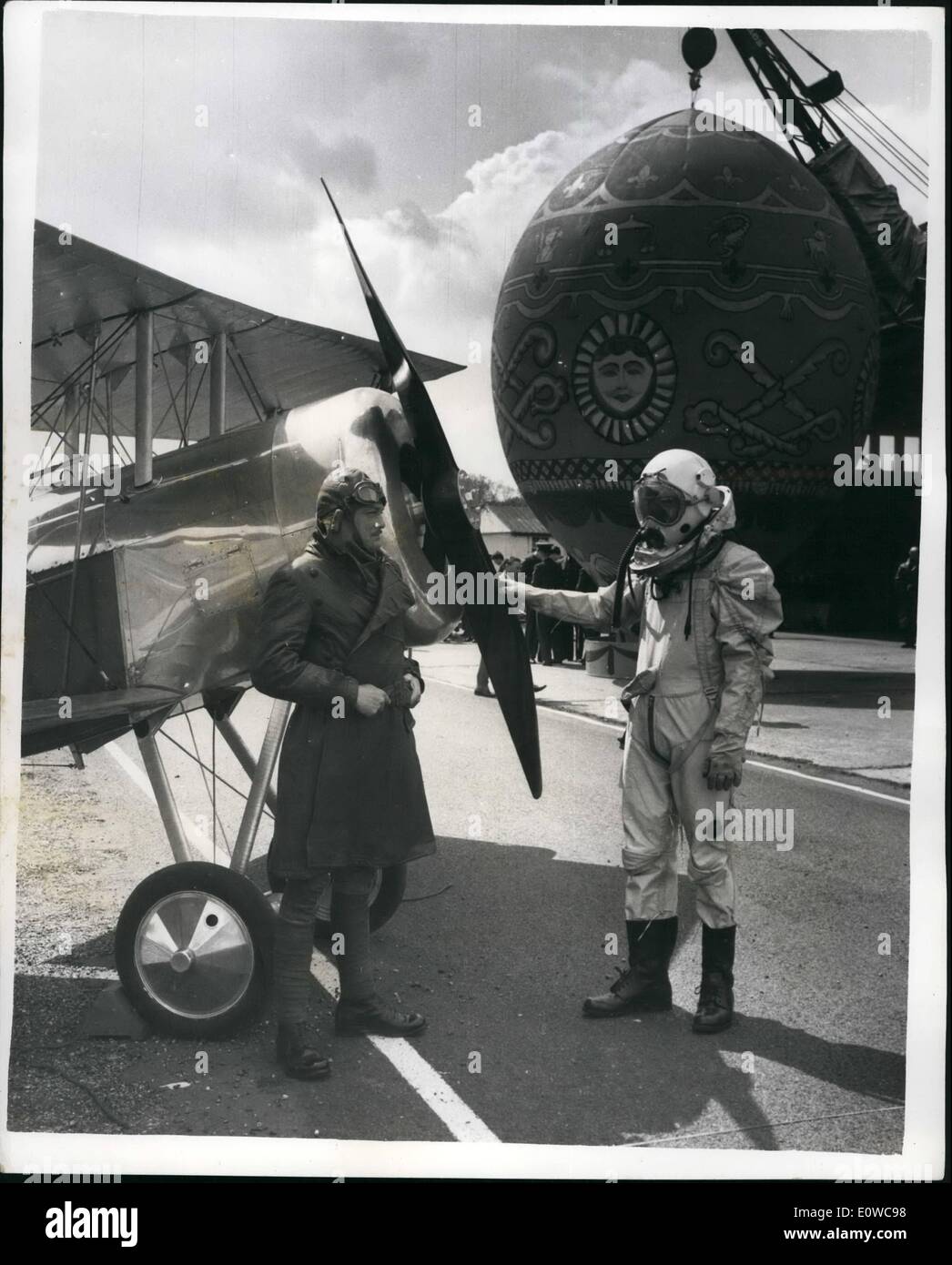 May 05, 1962 - The R.A.F. Prepares For The Royal Tournament. Fifty Years Of Aviation: ''A Cavalcade of Flying'' - is the theme of the R.A.F. contribution to the Royal Tournament which opens at Earls Court in July. It illustrates fifty years of aviation from the days of the hot-air balloon (1783) to a space-ship of the future. The ''Space-ship'' has been constructed by men of the R.A.F. from Unserviceable nose-cones -paint tin s etc.- at a cost of nothing. The display was open to members of the Press at Kenley, Surrey today. Photo shows ''Spaceman'' - S.A.C Stock Photo
