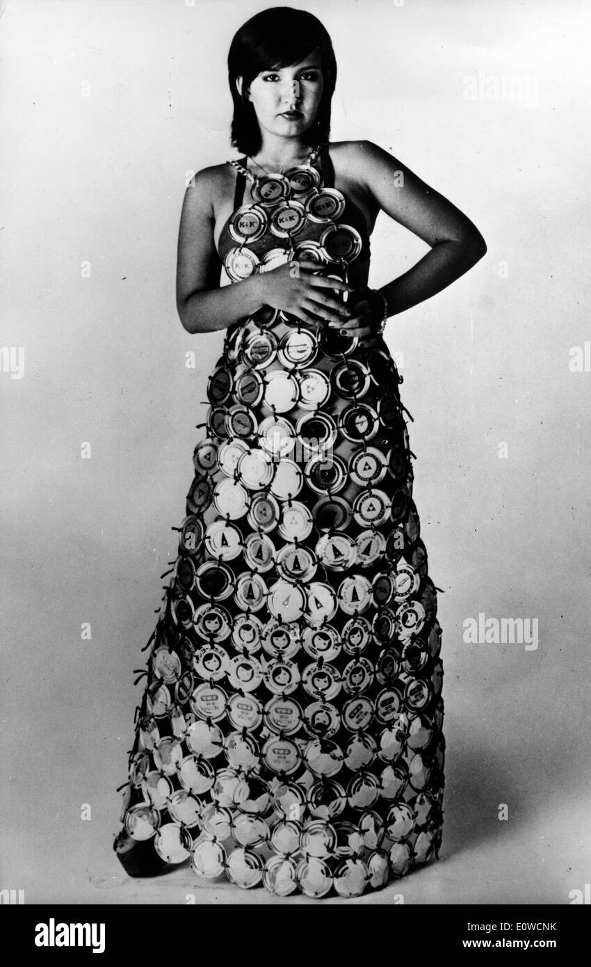 Model wearing a dress made out of can lids Stock Photo