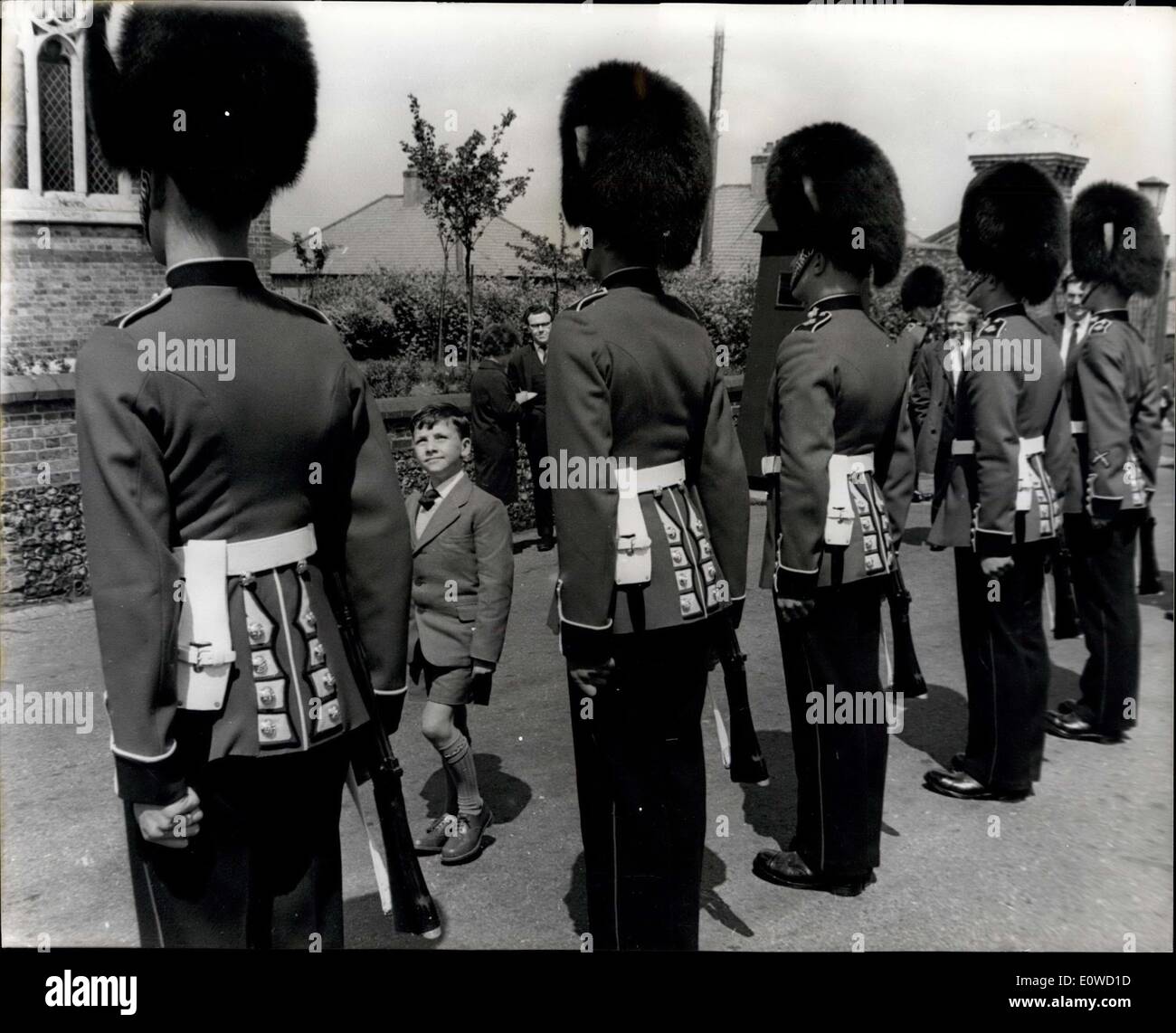 Jun. 01, 1962 - The Guardsman - aged nine: Nine year old Alexander Morris, son of a docker from Bootle, Lancasm is having the treat o his life - for he is the guest for three days of the Grenadier Guards at Catherham Barracks - as a reward for being the best marcher in a Youth Parade. Alex and his mother were met at Euston Station by Lieut. John Brown of the Grenadier Guards and after watching the Guards at St. James a Palace - be went to Caterham where visited the parade ground to 'Show the Guards how to march Stock Photo