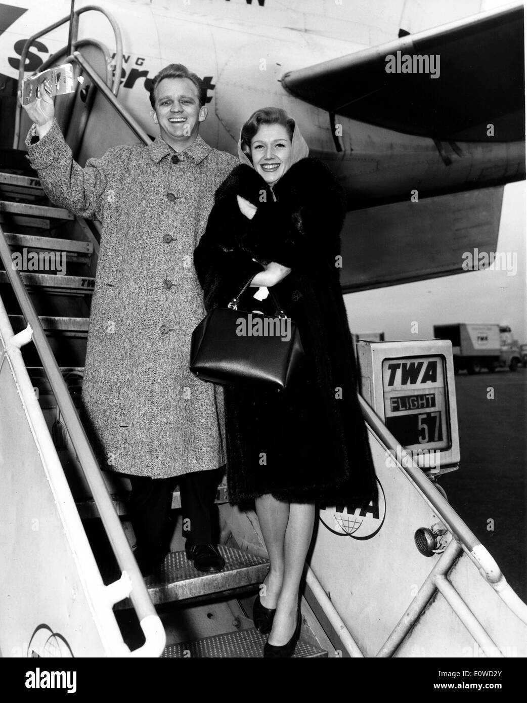 Gary Crosby boarding a TWA Jet stream with a woman Stock Photo