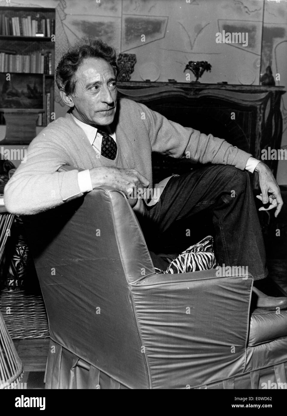 Jean Cocteau sitting in his study Stock Photo