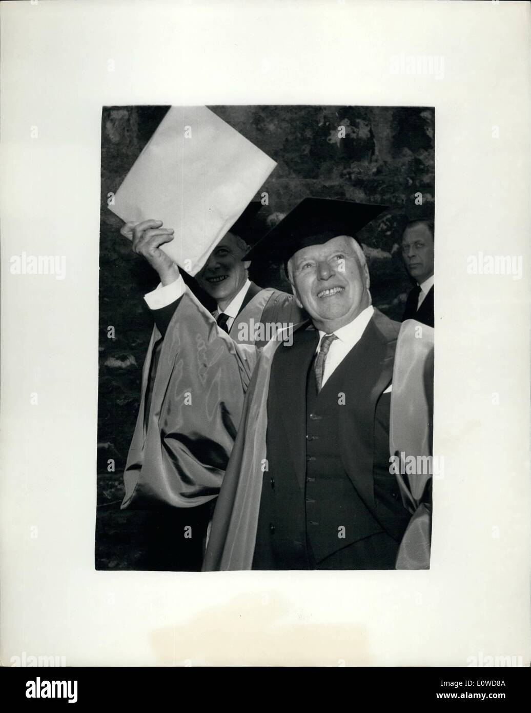 Jun. 06, 1962 Charlie Chaplin Receives Honorary Degree Oxford. He waves his Degree. Actor
