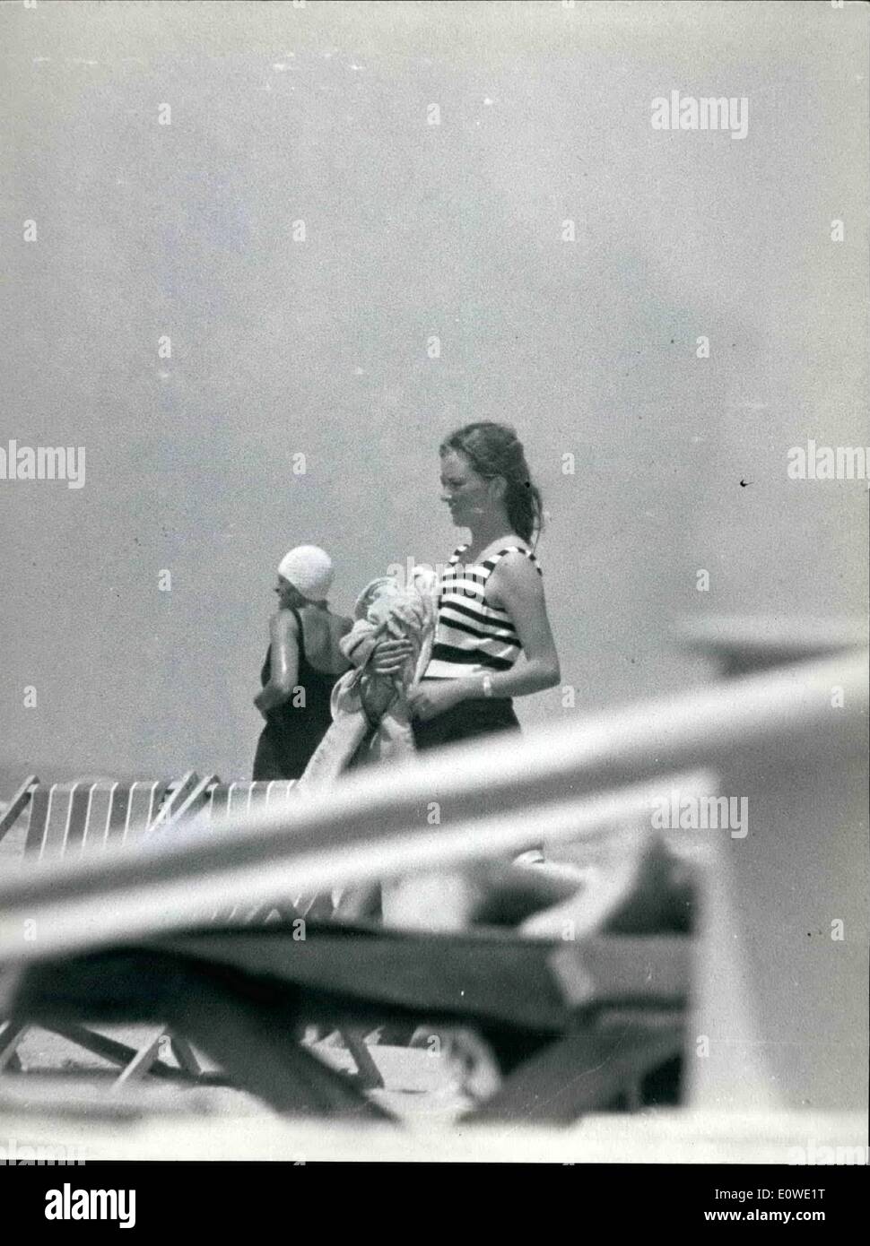 Jul. 07, 1962 - Paola di Liegi and her family at the beach of Marina di Massa, where they will stay for two months. The little Philippe enjoys himself on the beach, while his sister princess Astrid, sleeps on the baby carriage. Stock Photo