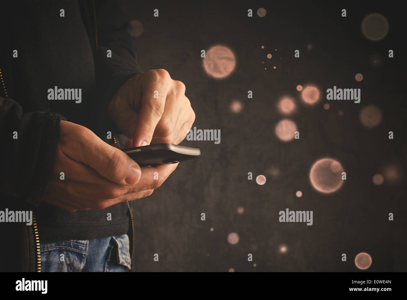 Hands hold mobile smart phone device. Stock Photo