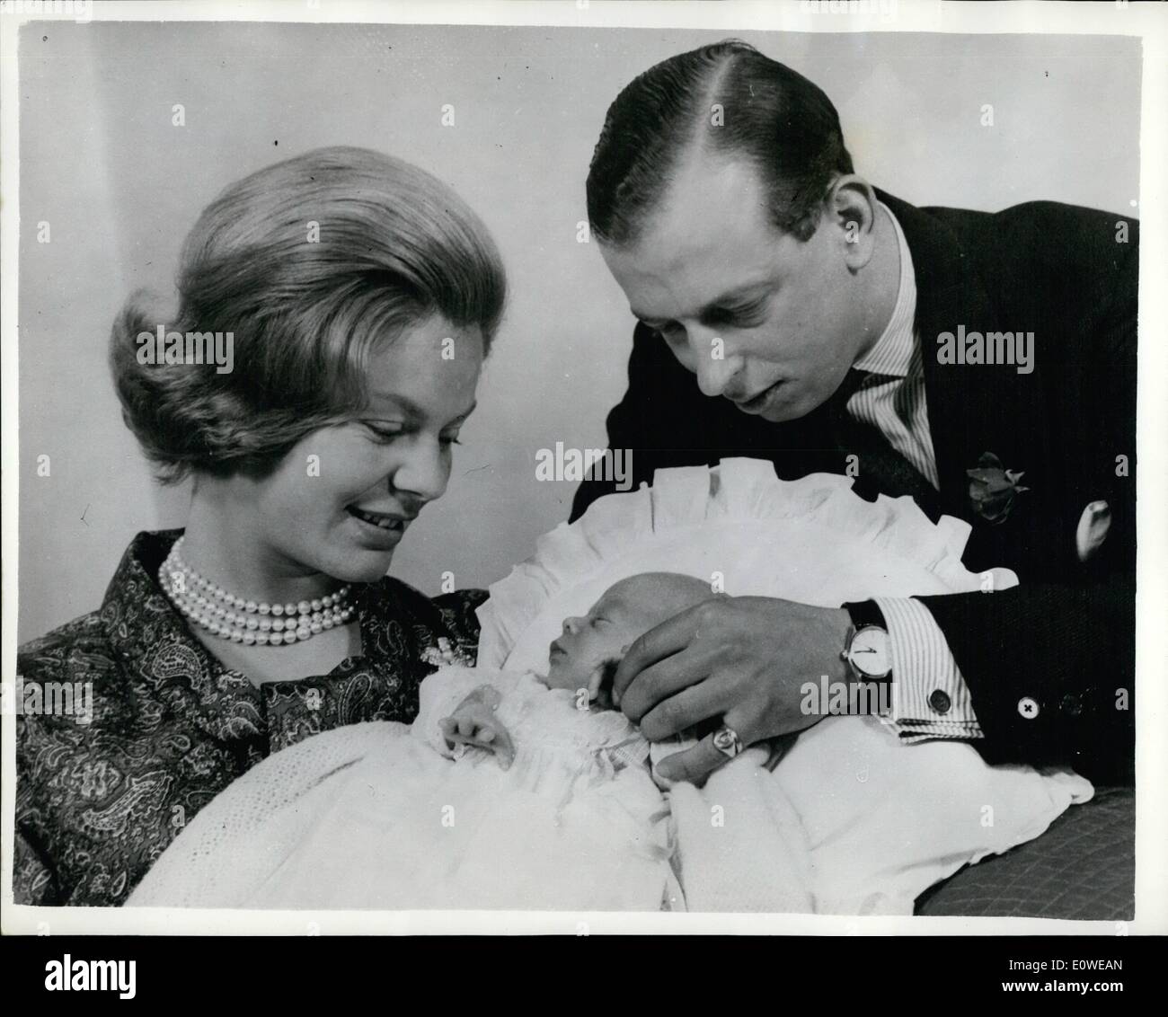 Jul. 07, 1962 - Presenting the Kents' Heir: Photo shows the Duchess of Kent pictured for the first time with her three-weeks-old son, the Earl of St. Andrew, with the Duke of Kent, who had the afternoon off from the War Office, yesterday. They are pictured at their new home, Coppins, in Iver, Bucks. Stock Photo