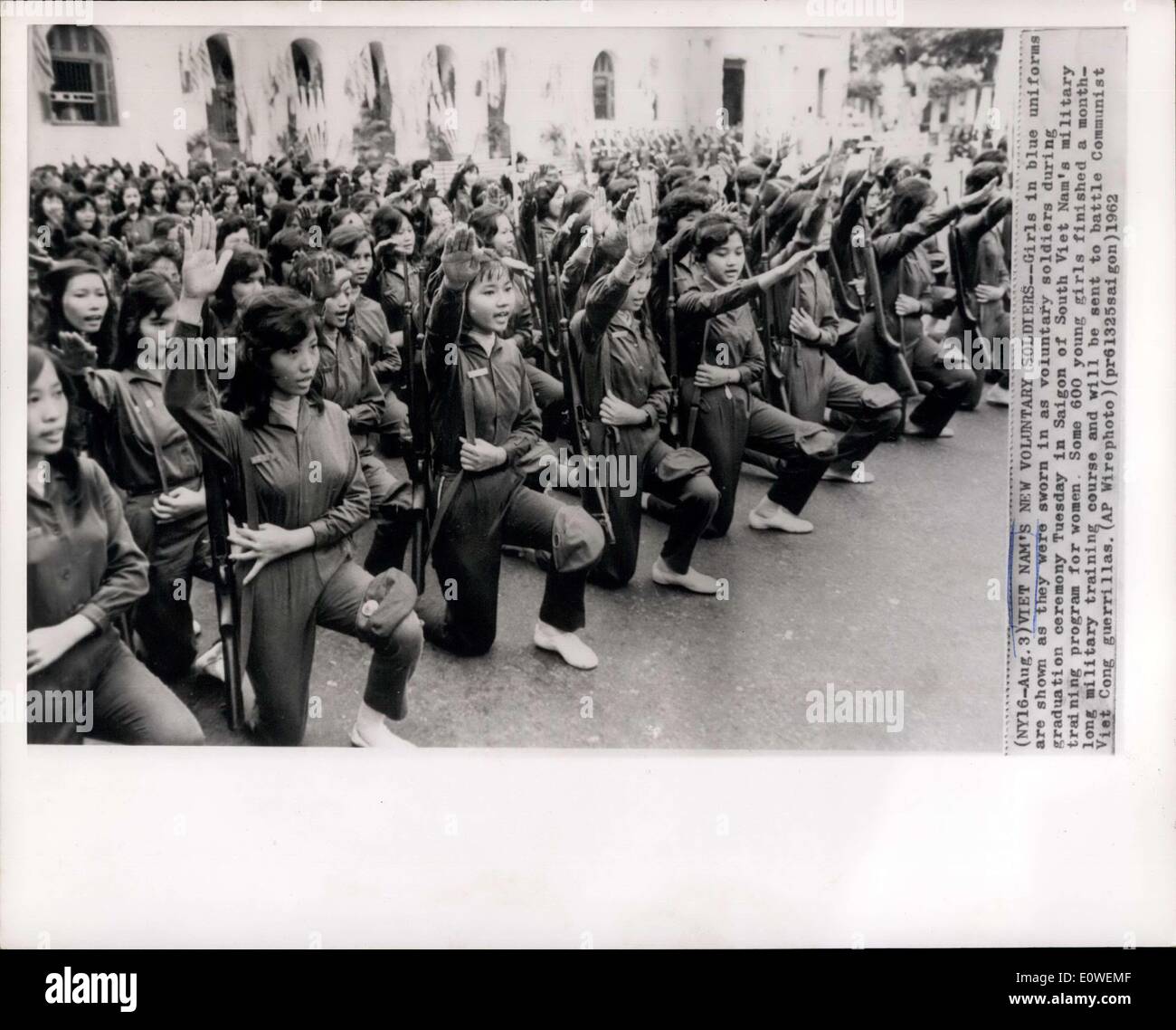 Aug. 03, 1962 - Vietnam;s new voluntary soldiers--Girls in blue uniforms are shown as they were sworn in as voluntary soldiers during graduation ceremony Tuesday in Saigon of South Vietnam's military training programme for women. Some 600 young girls finished a month long military training course and will be sent to battle Communist Viet Cong Guerrillas. Stock Photo