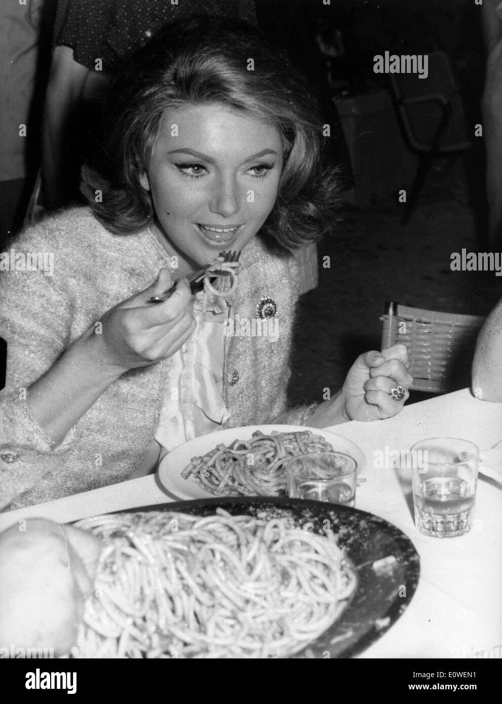 Actress Sylva Koscina eating spaghetti Stock Photo